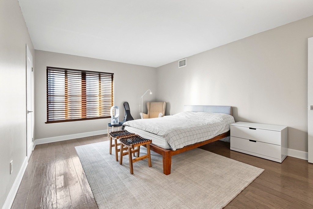 30 Stearns Road, Unit 201 Brookline, MA 02446 - Photo 12 of 29 a bedroom with a bed and a window