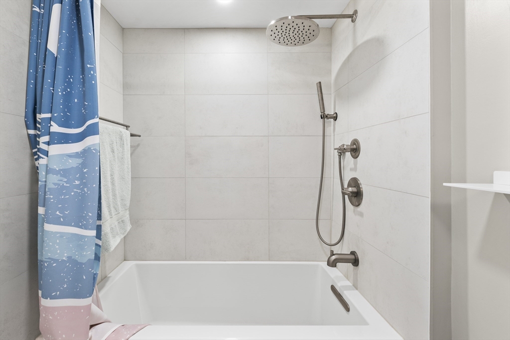 30 Stearns Road, Unit 201 Brookline, MA 02446 - Photo 14 of 29 a bathroom with a bath tub and shower