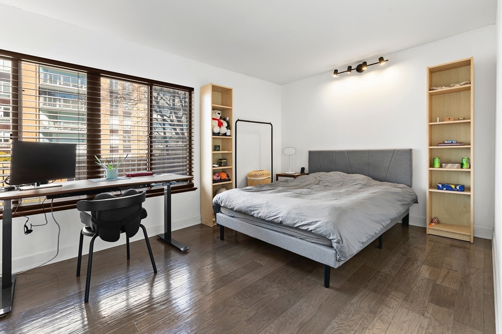 30 Stearns Road, Unit 201 Brookline, MA 02446 - Photo 15 of 29 a bedroom with a bed and a desk