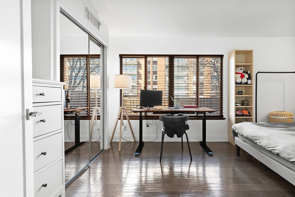 30 Stearns Road, Unit 201 Brookline, MA 02446 - Photo 16 of 29 a living room with furniture a large window and a table