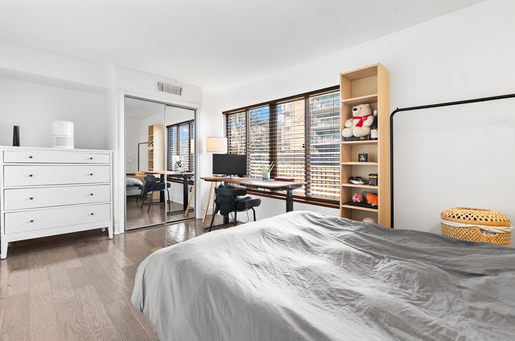 30 Stearns Road, Unit 201 Brookline, MA 02446 - Photo 17 of 29 a bedroom with a bed and a large window