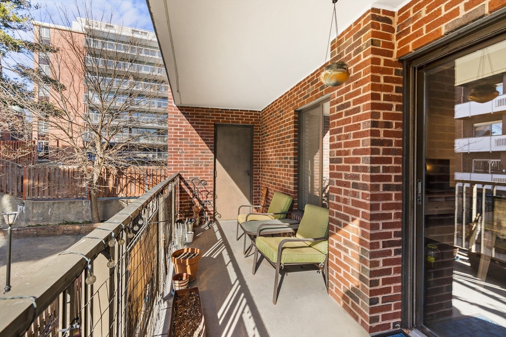 30 Stearns Road, Unit 201 Brookline, MA 02446 - Photo 20 of 29 a balcony view with two chairs and a table