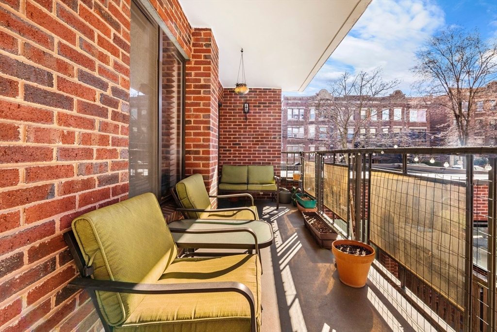 30 Stearns Road, Unit 201 Brookline, MA 02446 - Photo 21 of 29 a view of balcony with two chairs and a rug