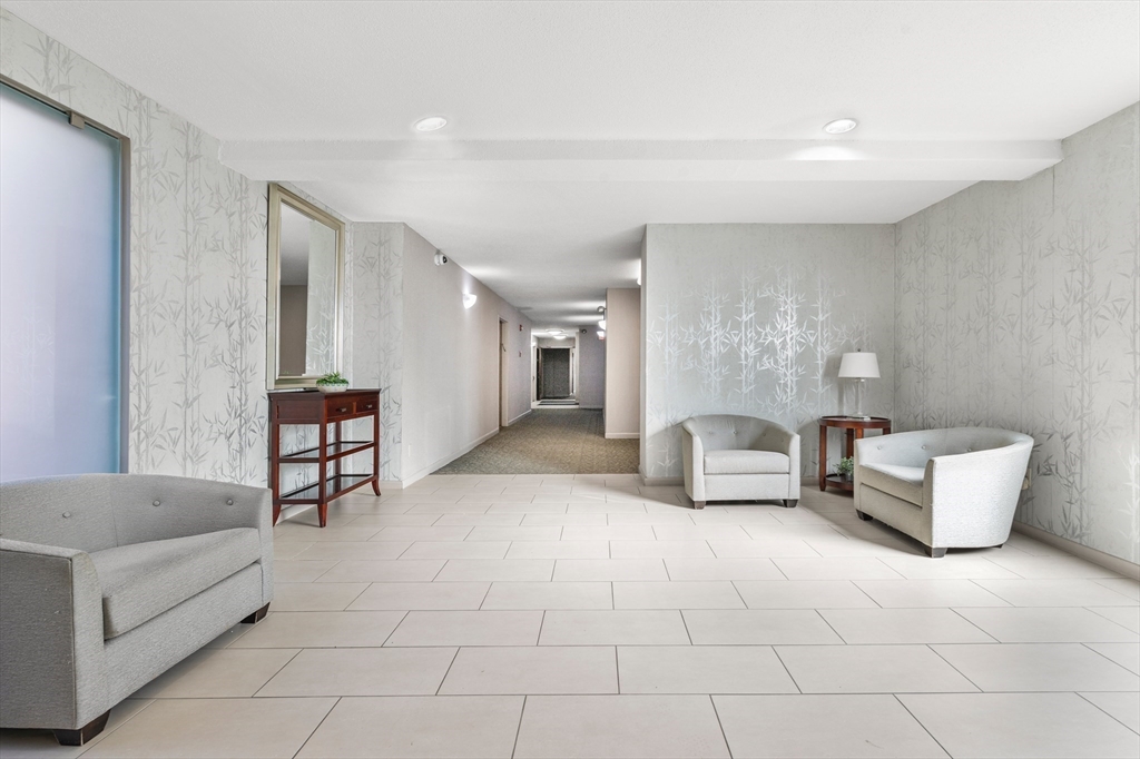 30 Stearns Road, Unit 201 Brookline, MA 02446 - Photo 25 of 29 a living room with furniture and a couch