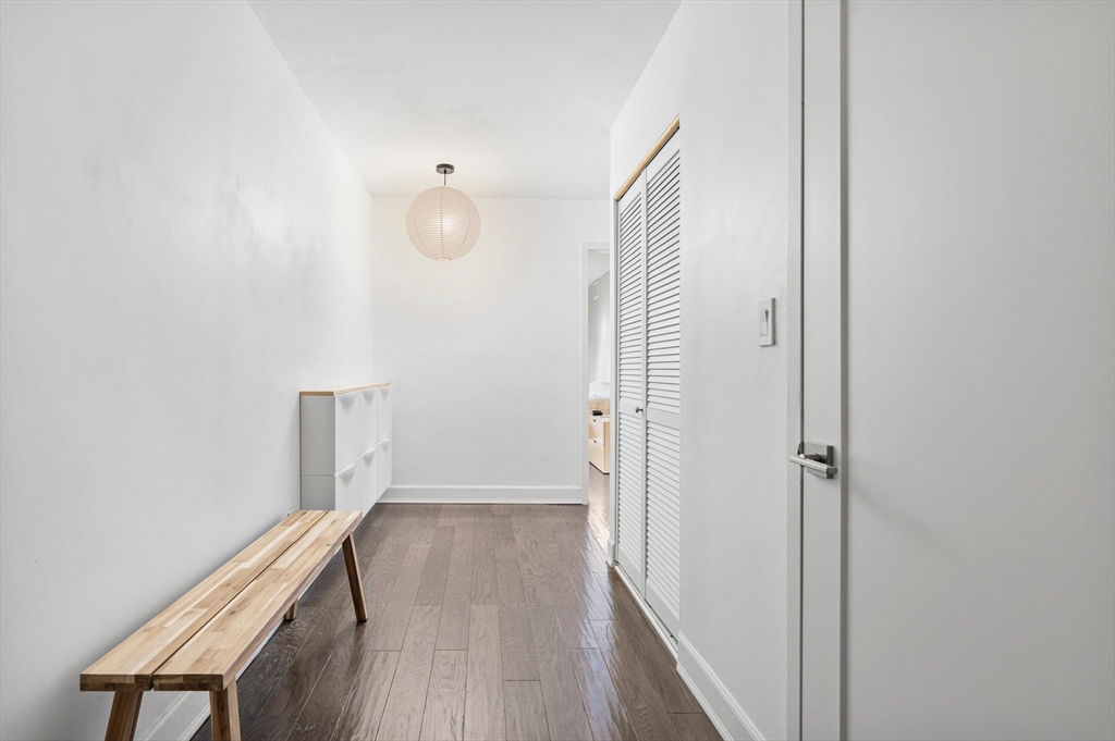 30 Stearns Road, Unit 201 Brookline, MA 02446 - Photo 10 of 29 a view of a hallway with wooden floor
