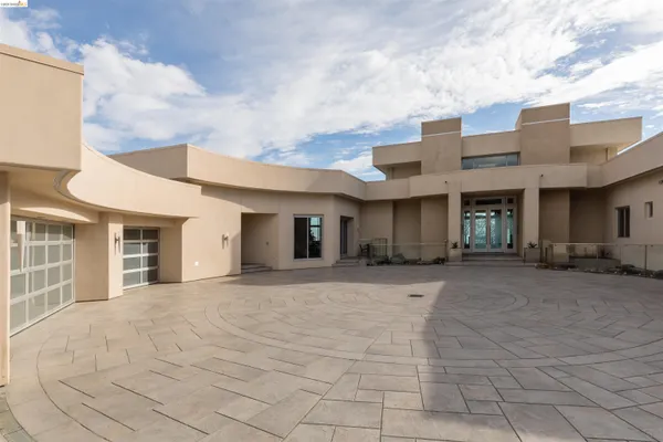 a view of a house with basketball court