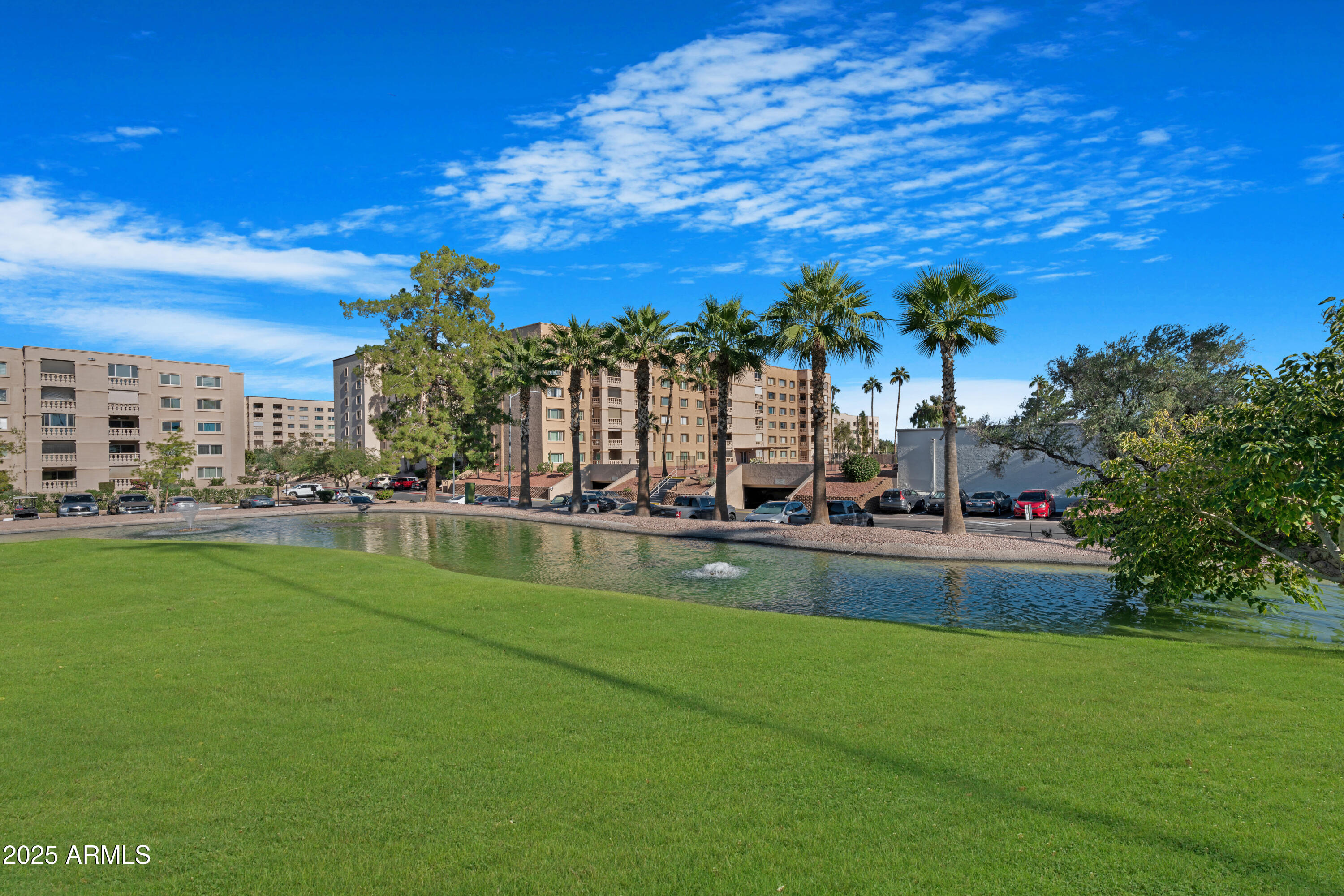 7820 East Camelback Road, Unit 510 Scottsdale, AZ 85251 - Photo 16 of 50 a view of swimming pool is middle in the garden