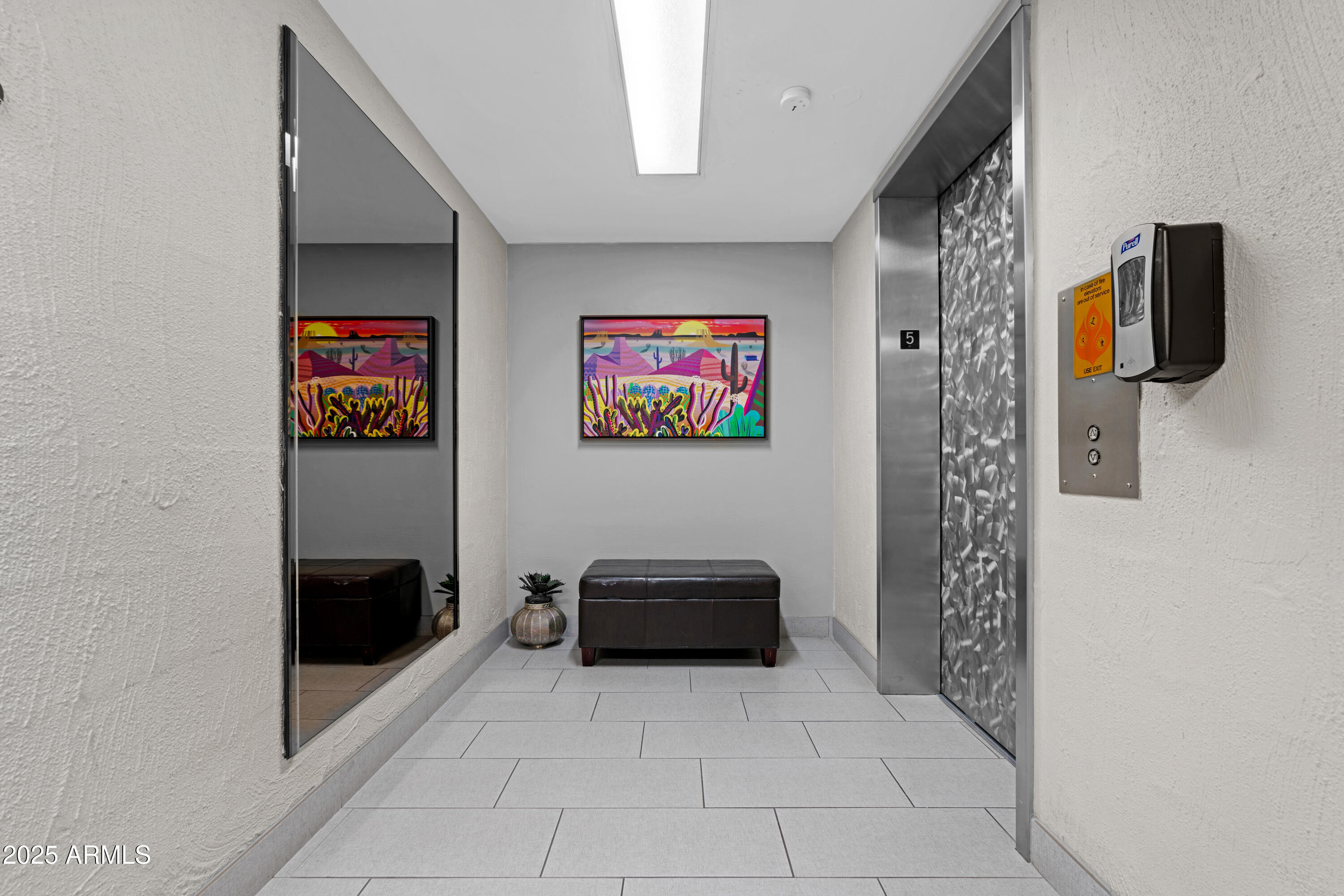 7820 East Camelback Road, Unit 510 Scottsdale, AZ 85251 - Photo 22 of 50 a living room with furniture and a flat screen tv