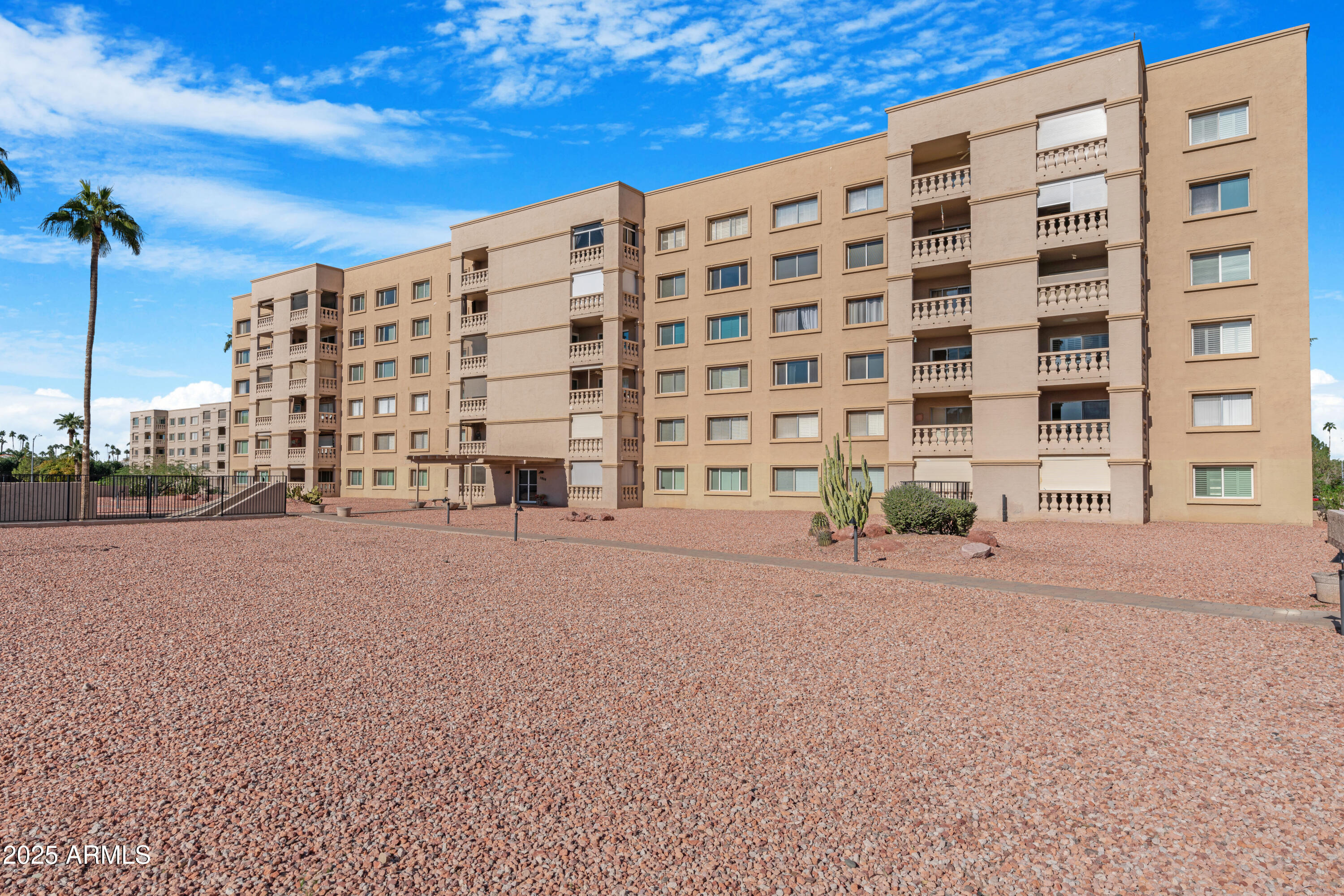 7820 East Camelback Road, Unit 510 Scottsdale, AZ 85251 - Photo 25 of 50 a tall building with a outdoor space