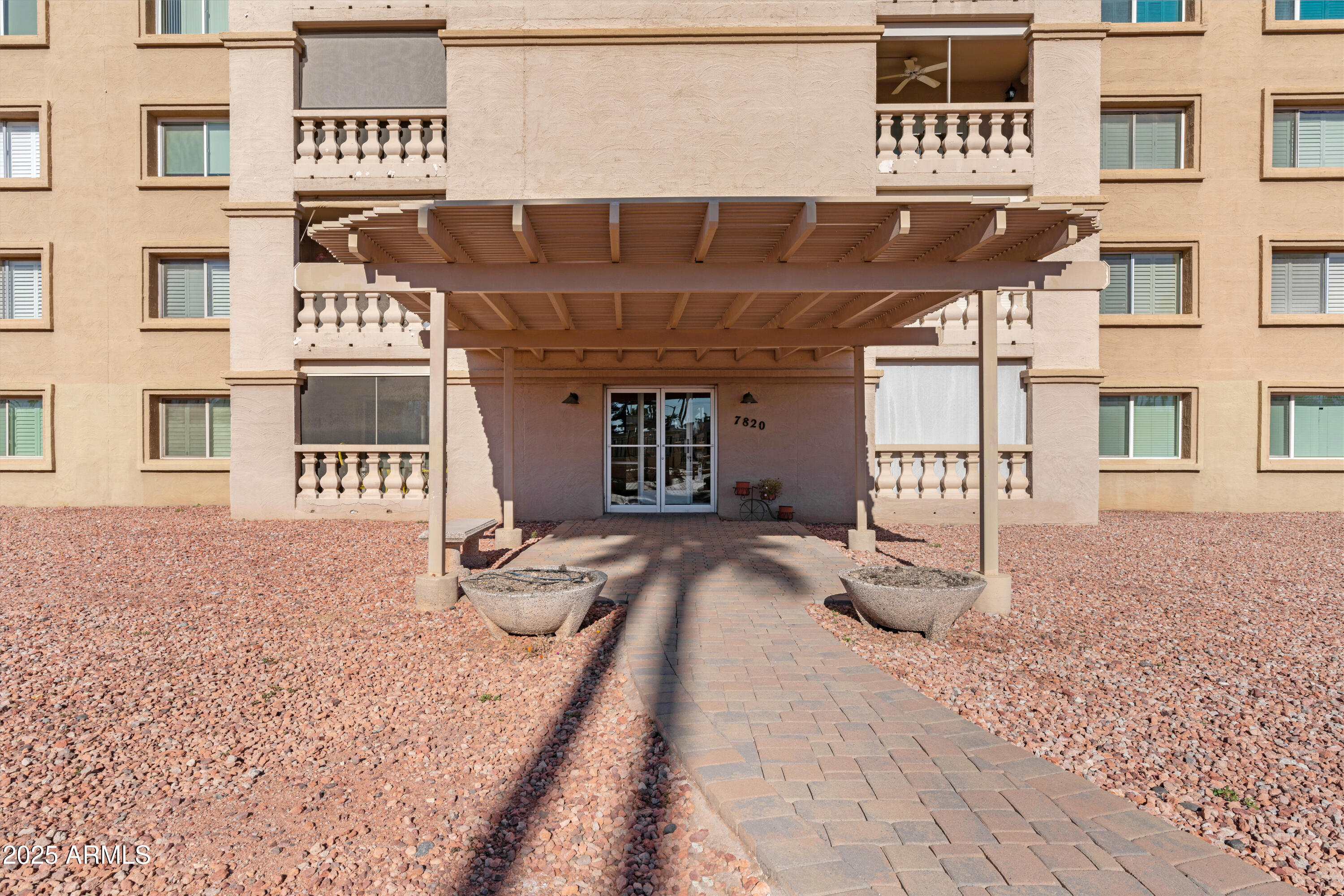 7820 East Camelback Road, Unit 510 Scottsdale, AZ 85251 - Photo 26 of 50 a front view of a building with a bench