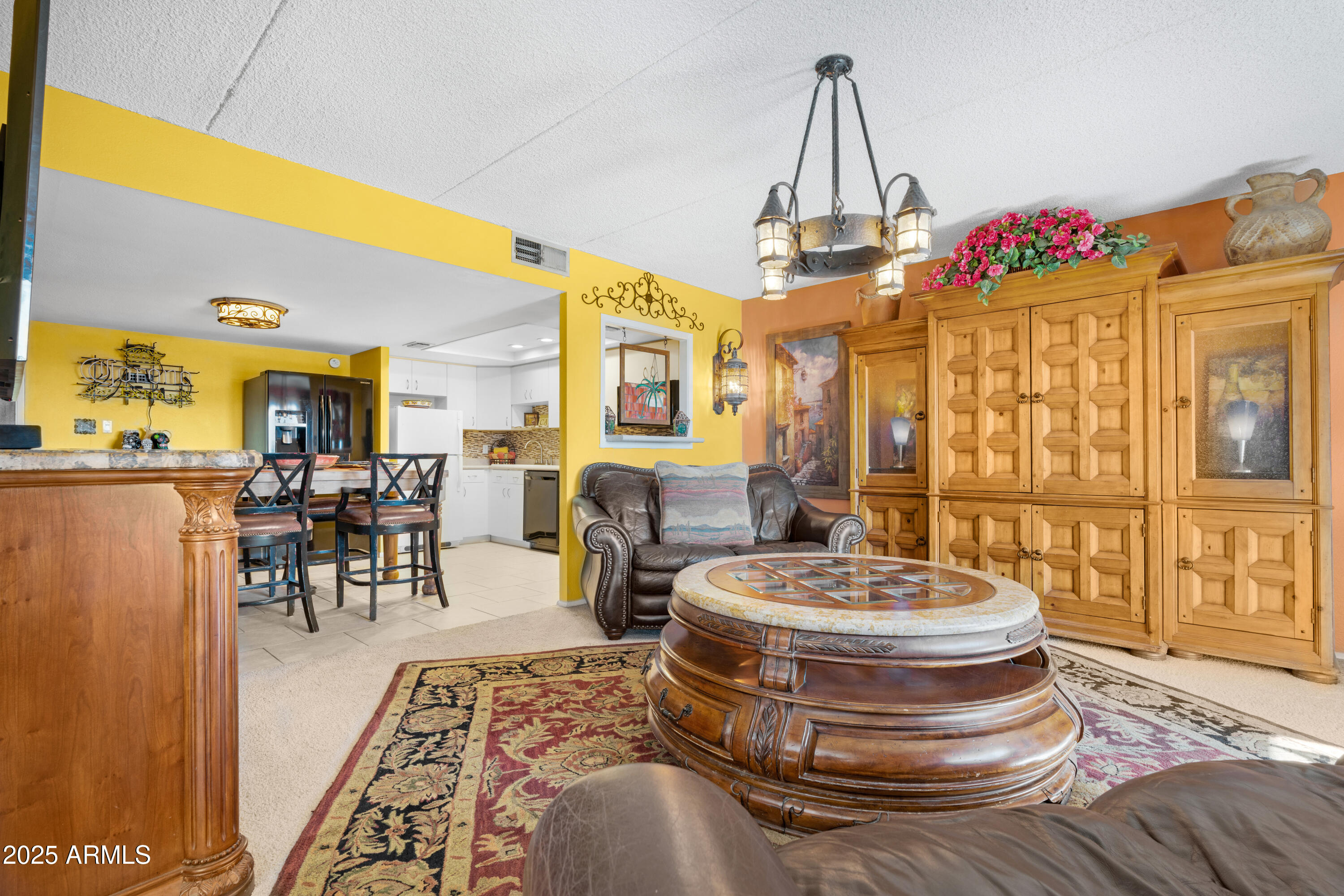 7820 East Camelback Road, Unit 510 Scottsdale, AZ 85251 - Photo 39 of 50 a room with chandelier furniture and a chandelier