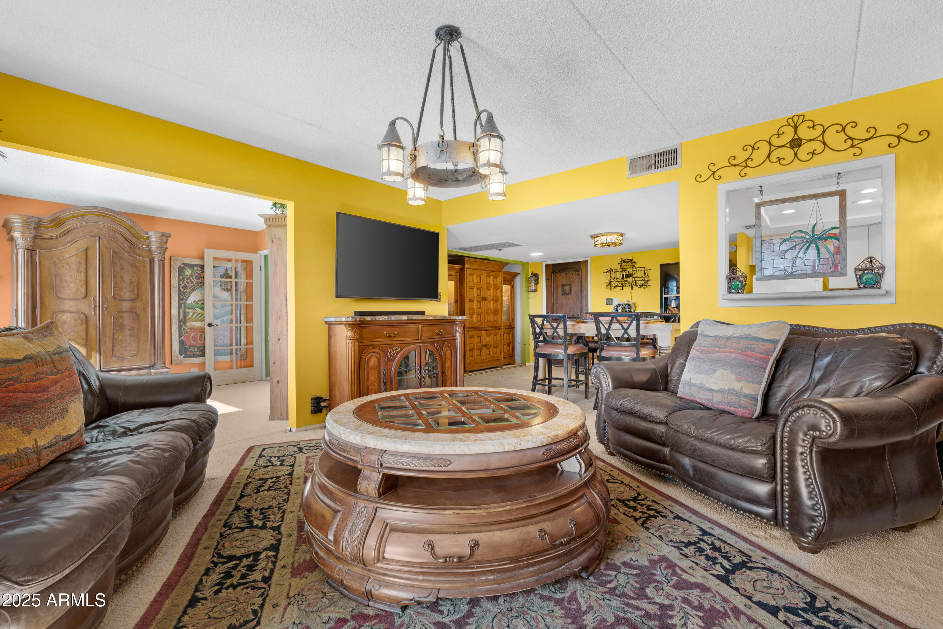 7820 East Camelback Road, Unit 510 Scottsdale, AZ 85251 - Photo 40 of 50 a living room with furniture and a chandelier