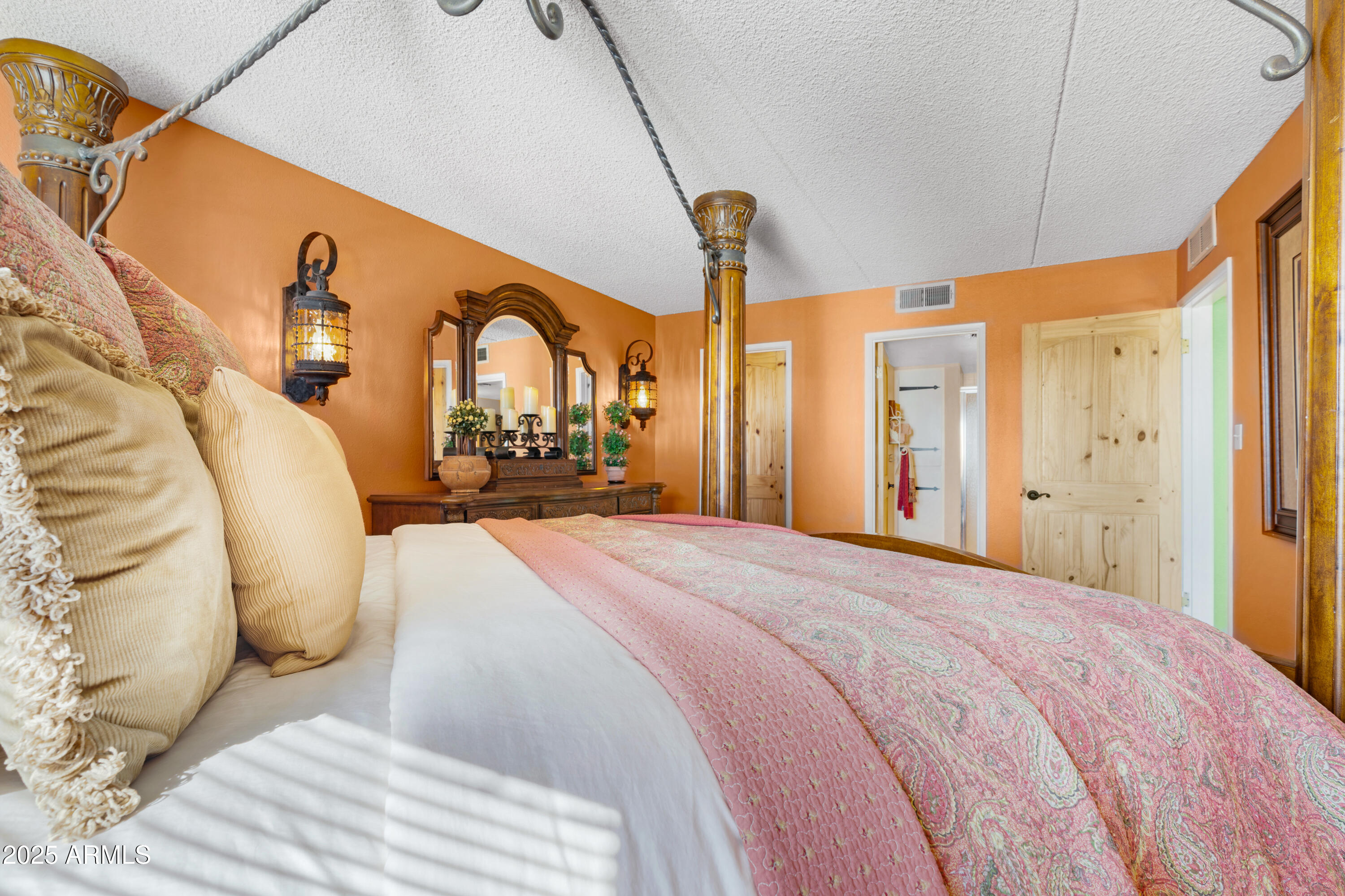 7820 East Camelback Road, Unit 510 Scottsdale, AZ 85251 - Photo 47 of 50 a spacious bedroom with a bed a dresser next to a window