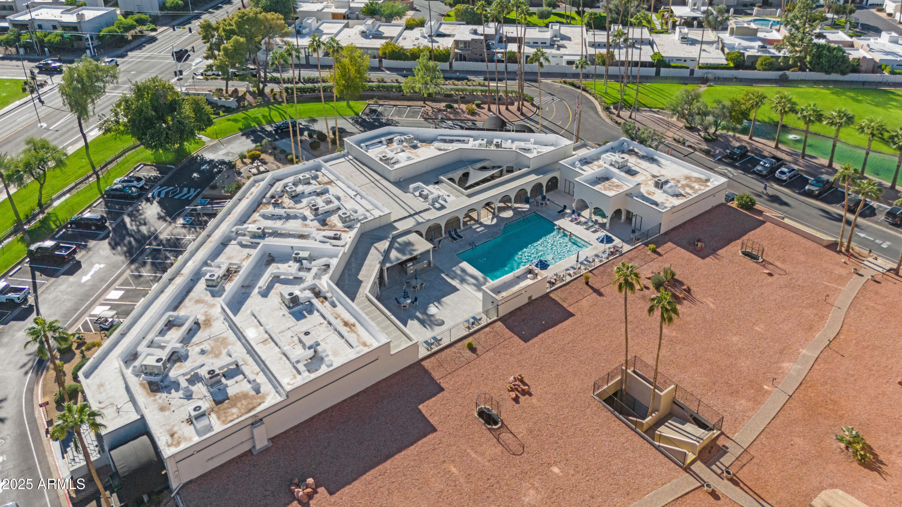 7820 East Camelback Road, Unit 510 Scottsdale, AZ 85251 - Photo 7 of 50 an aerial view of a house with a garden and lake view