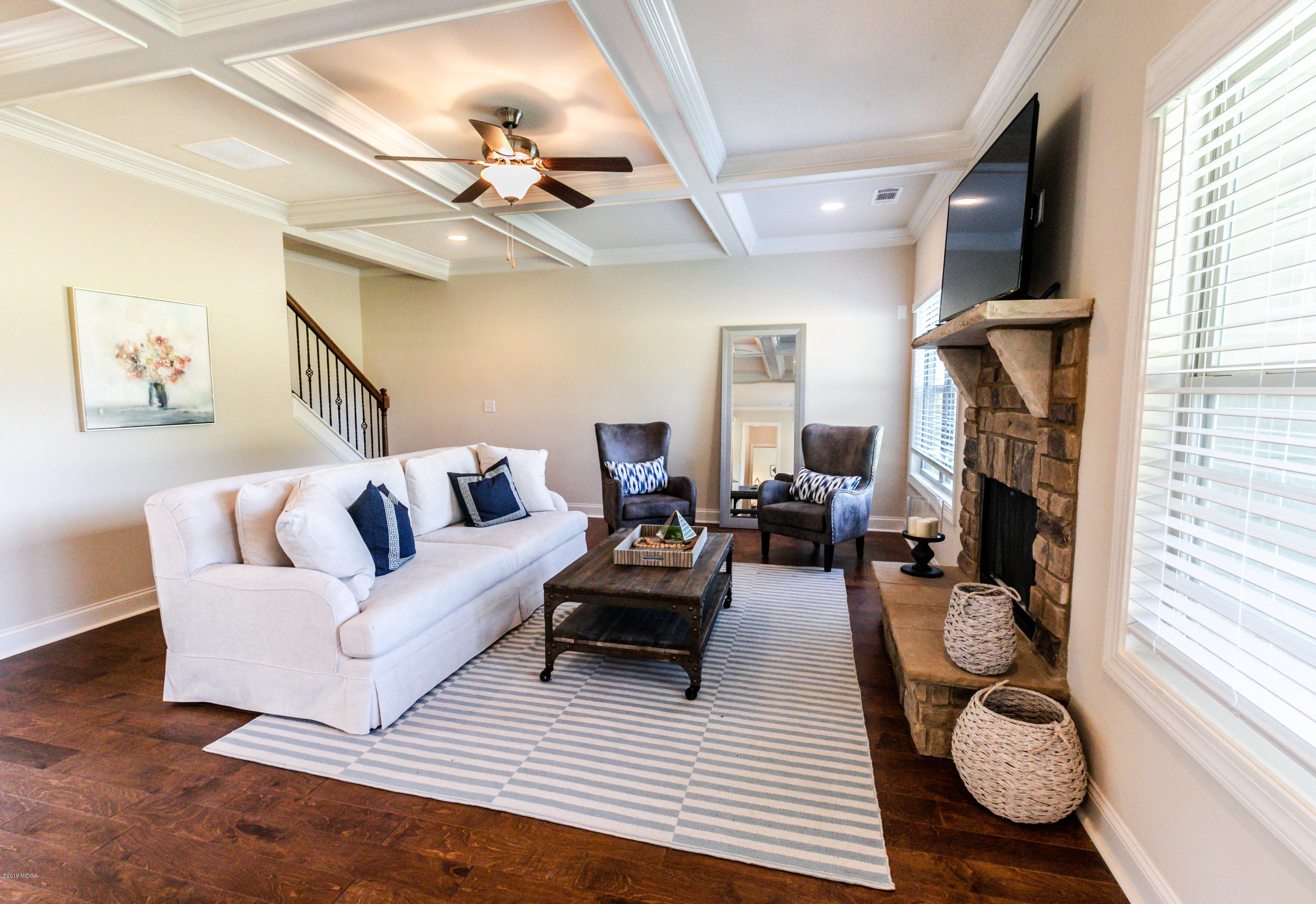 160 Homestead Circle Forsyth, GA 31029 - Photo 12 of 40 a living room with furniture and a fireplace