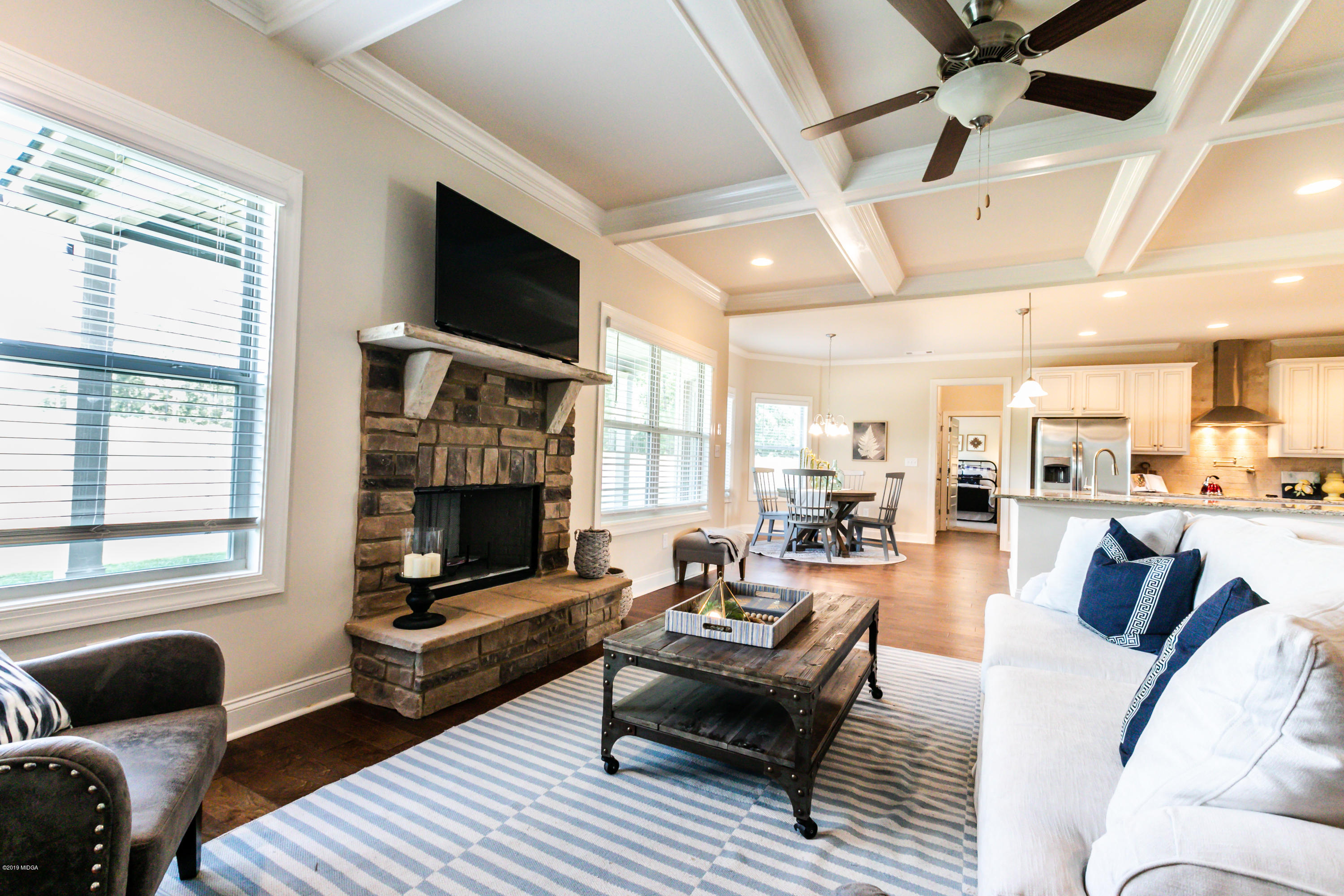 160 Homestead Circle Forsyth, GA 31029 - Photo 13 of 40 a living room with furniture fireplace and a flat screen tv