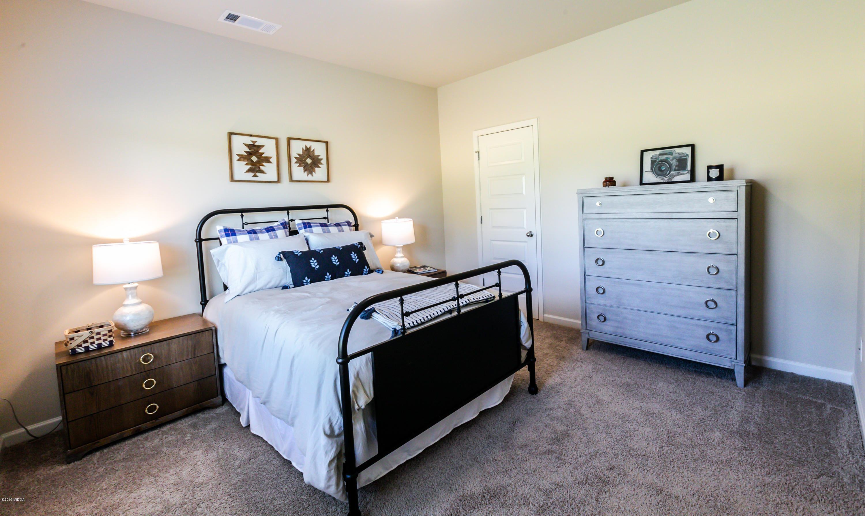 160 Homestead Circle Forsyth, GA 31029 - Photo 14 of 40 a bedroom with a bed and a closet