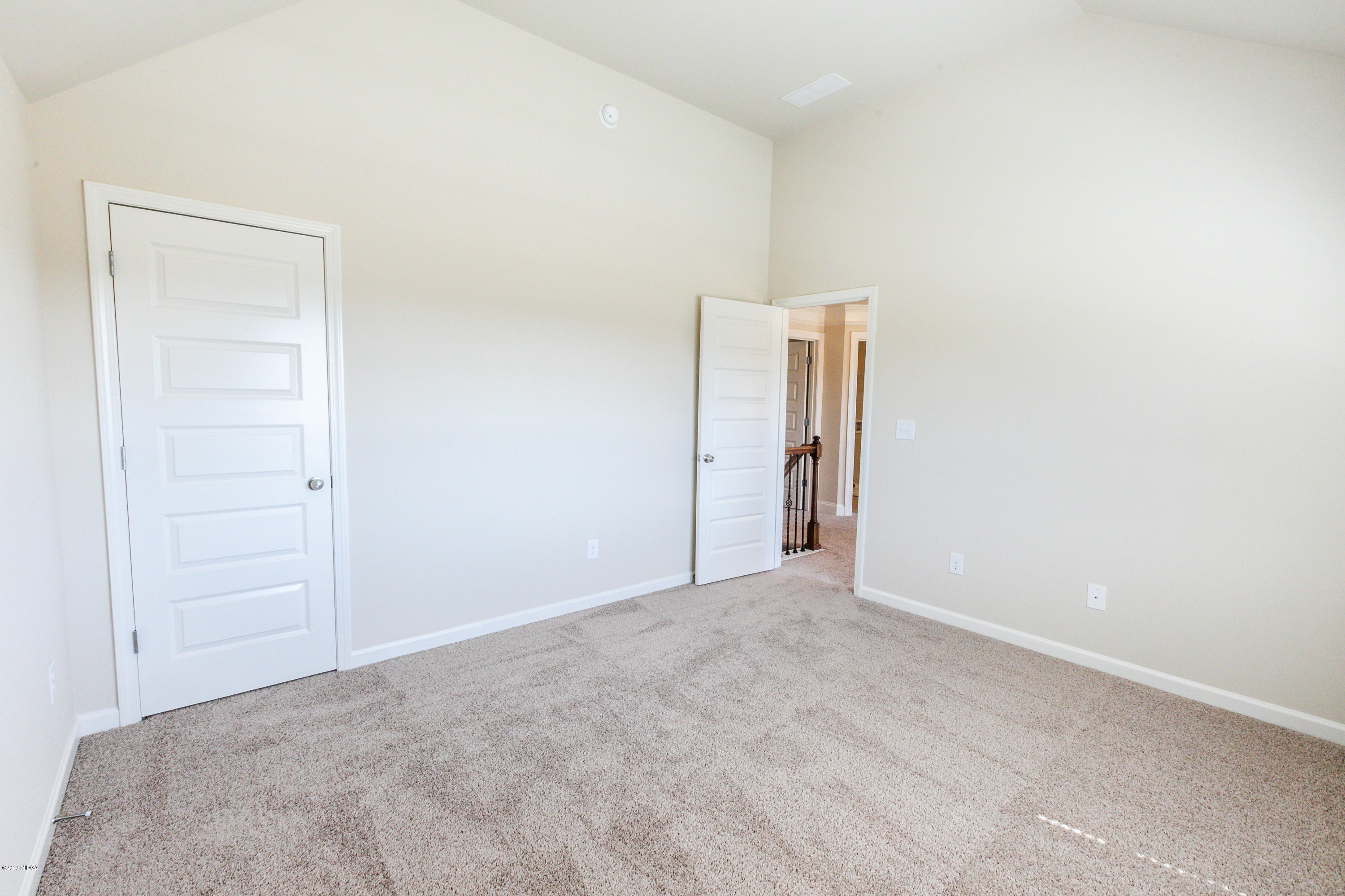 160 Homestead Circle Forsyth, GA 31029 - Photo 18 of 40 an empty room with closet area