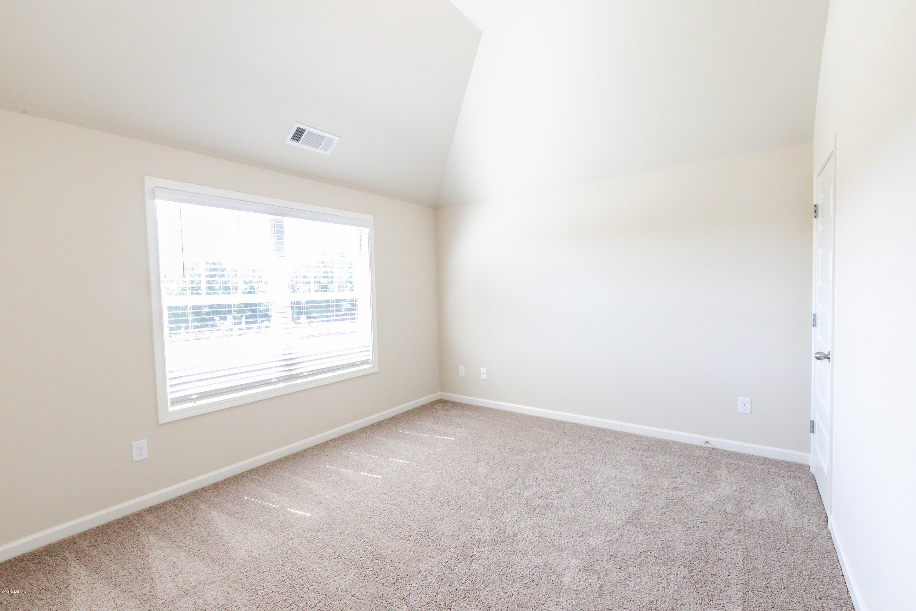 160 Homestead Circle Forsyth, GA 31029 - Photo 19 of 40 an empty room with a window