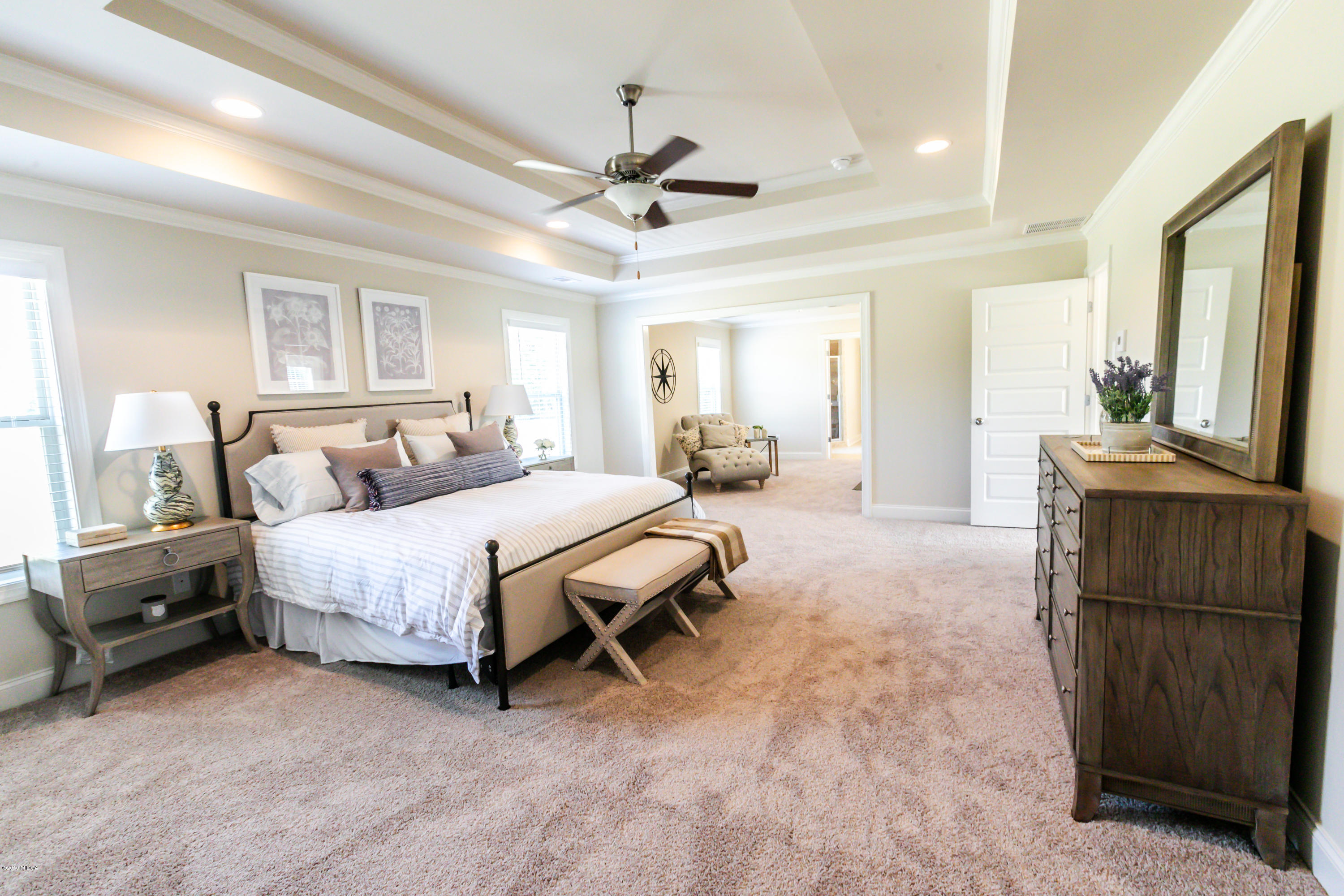160 Homestead Circle Forsyth, GA 31029 - Photo 20 of 40 a spacious bedroom with a bed and wooden floor