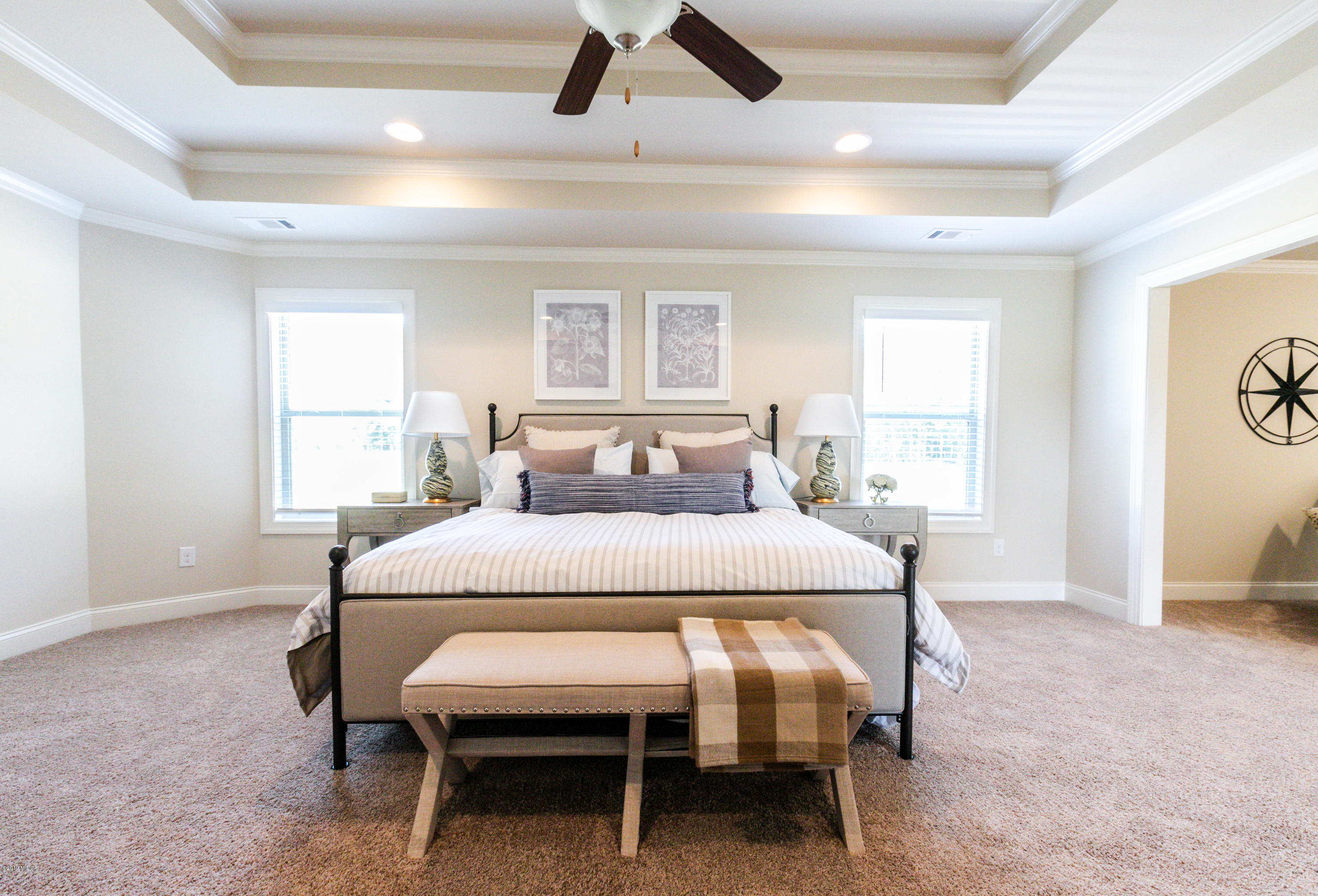 160 Homestead Circle Forsyth, GA 31029 - Photo 21 of 40 a bedroom with a bed a table and chair