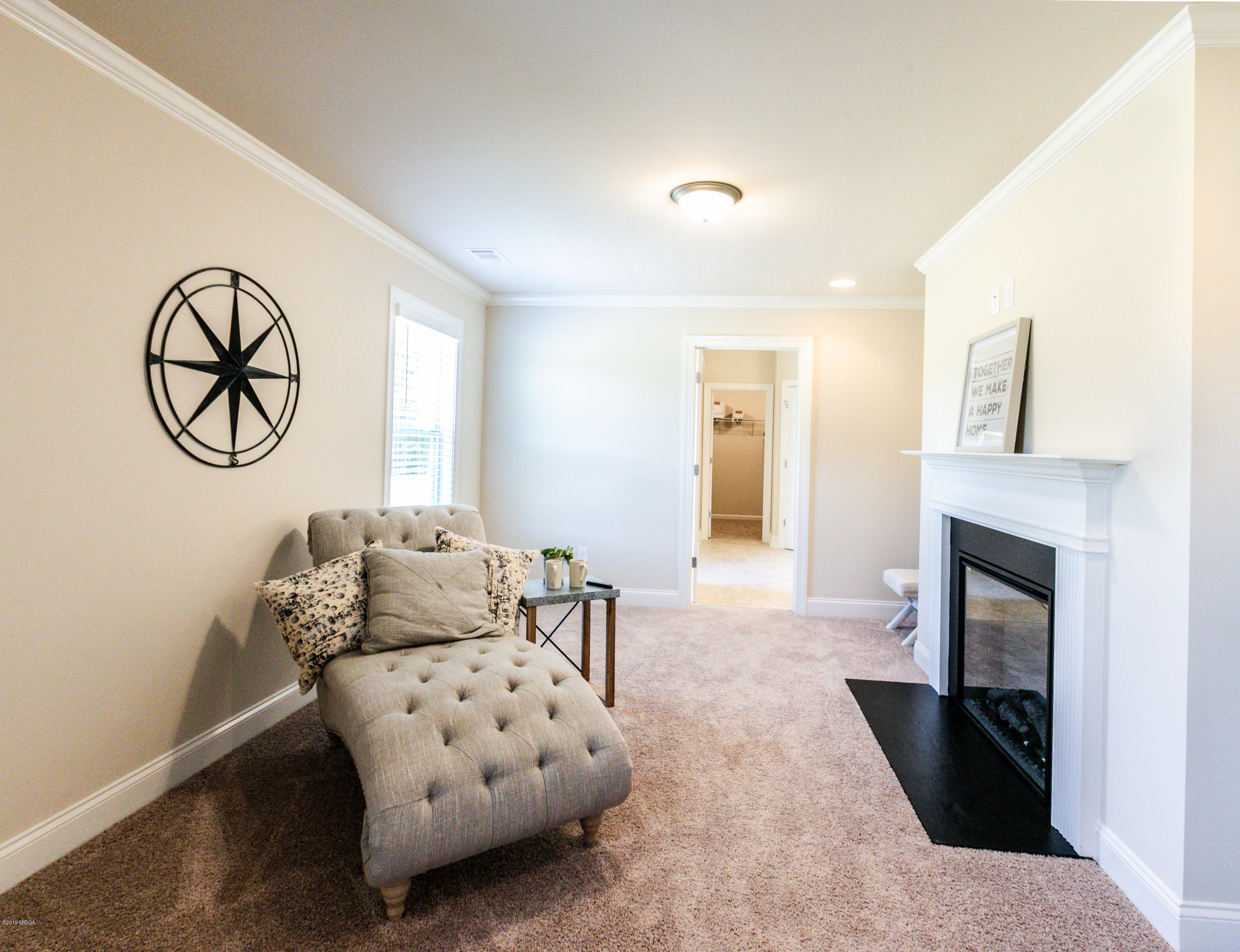 160 Homestead Circle Forsyth, GA 31029 - Photo 22 of 40 a living room with furniture and fireplace