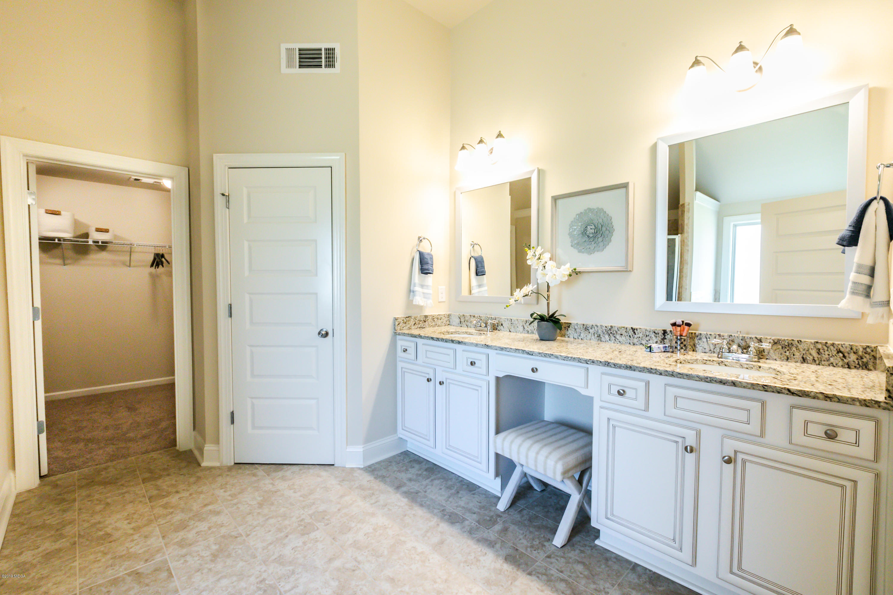 160 Homestead Circle Forsyth, GA 31029 - Photo 23 of 40 a bathroom with a granite countertop sink mirror and a