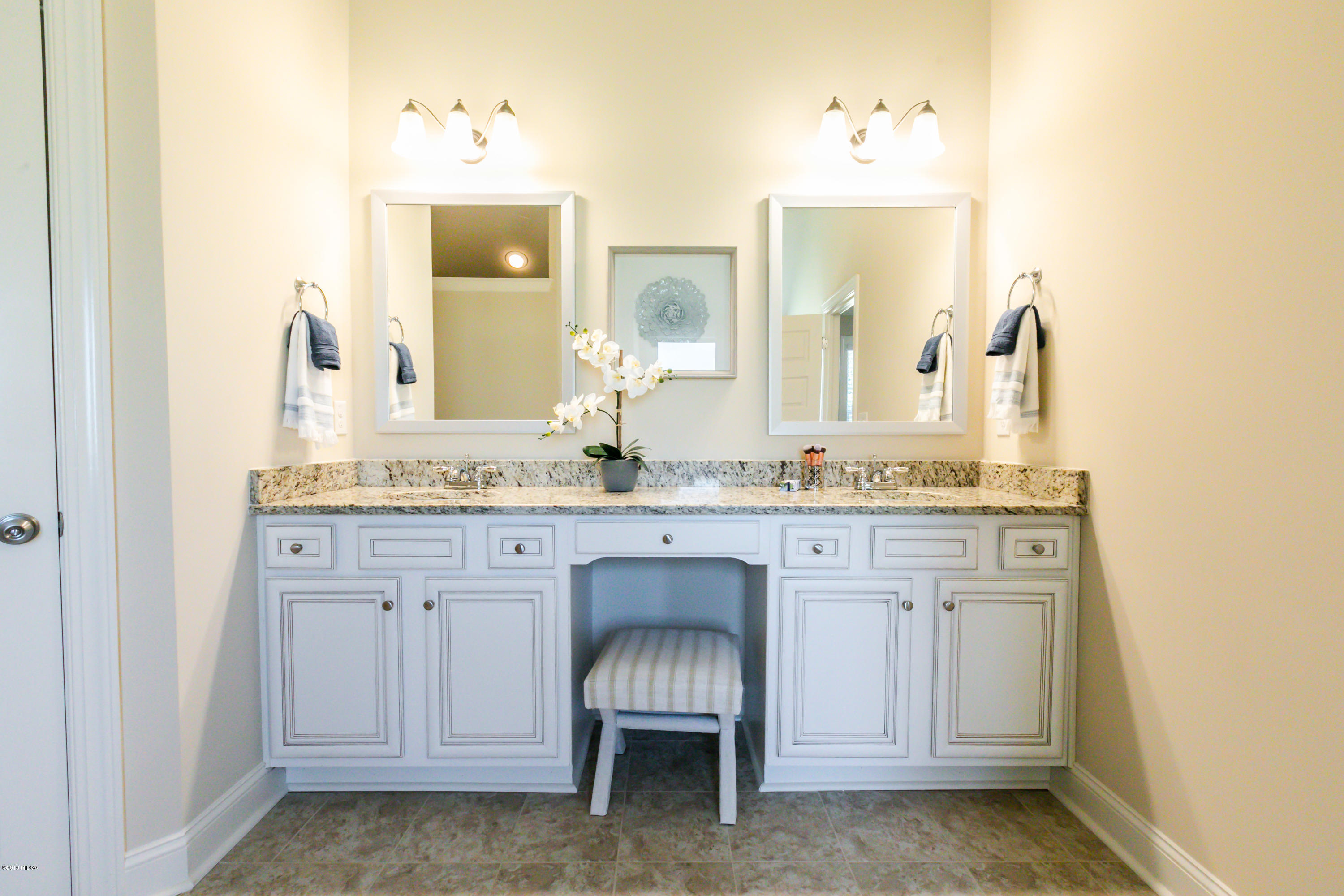 160 Homestead Circle Forsyth, GA 31029 - Photo 24 of 40 a bathroom with a sink and a mirror