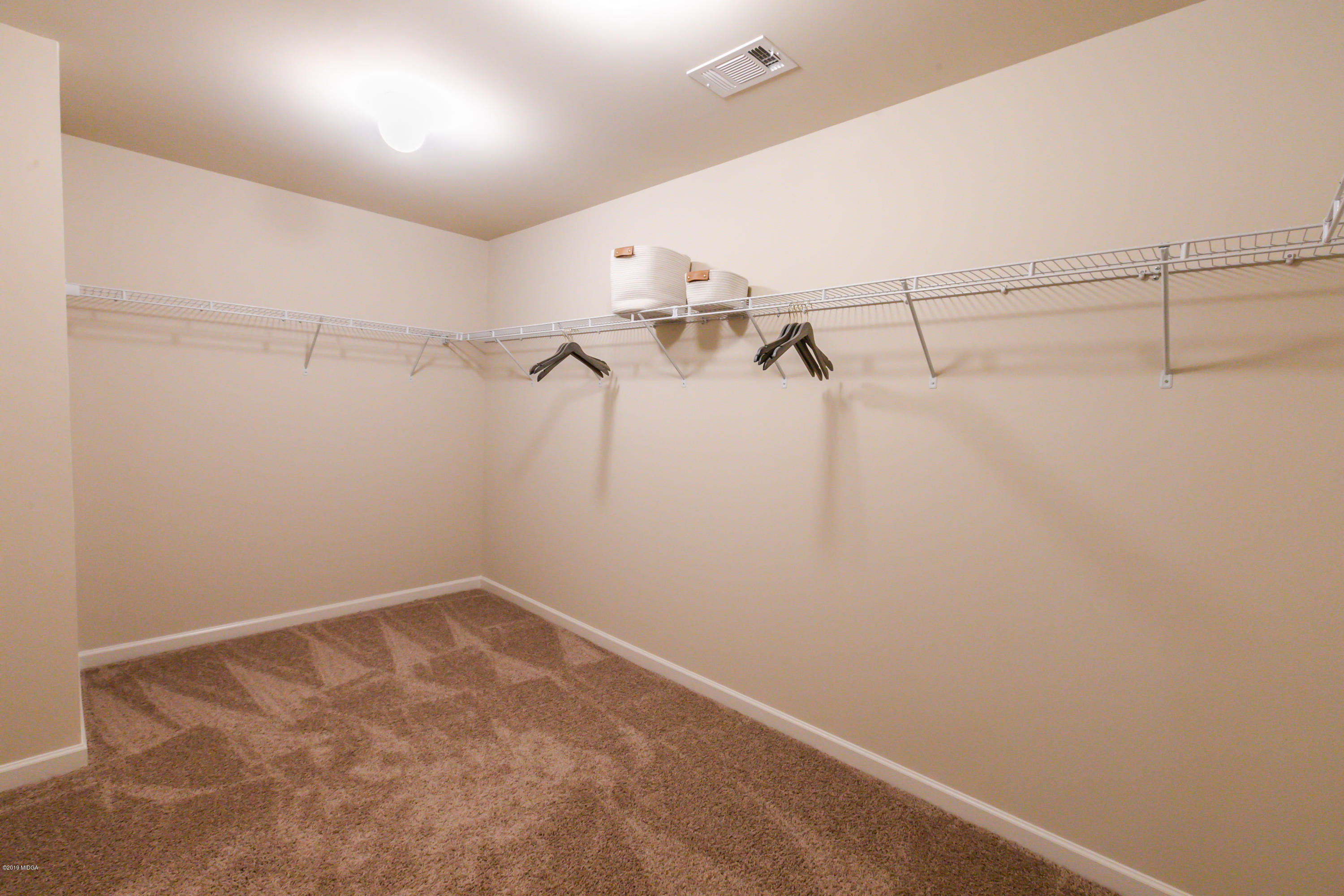 160 Homestead Circle Forsyth, GA 31029 - Photo 30 of 40 a view of a room with racks on the wall