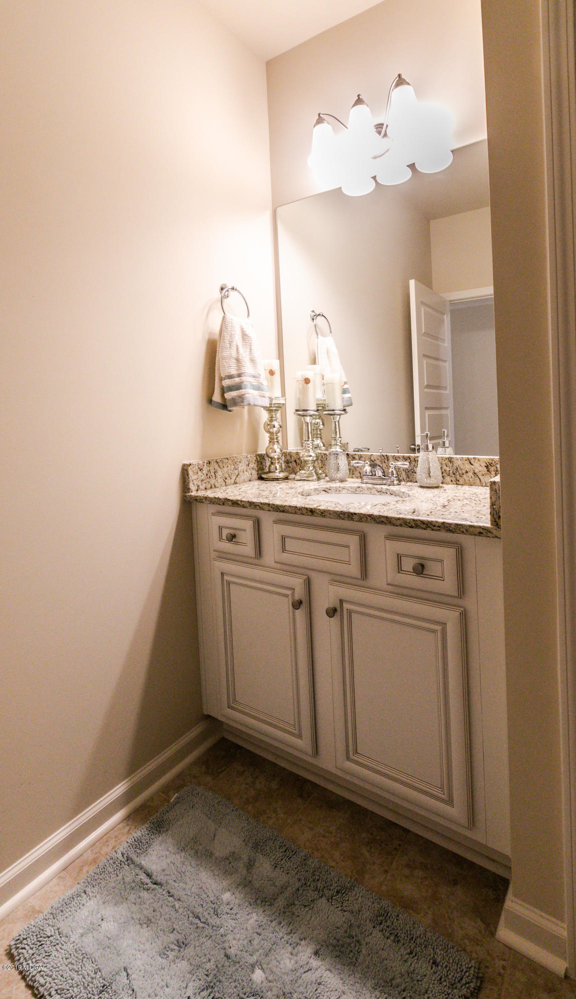 160 Homestead Circle Forsyth, GA 31029 - Photo 34 of 40 a kitchen with a sink and cabinets