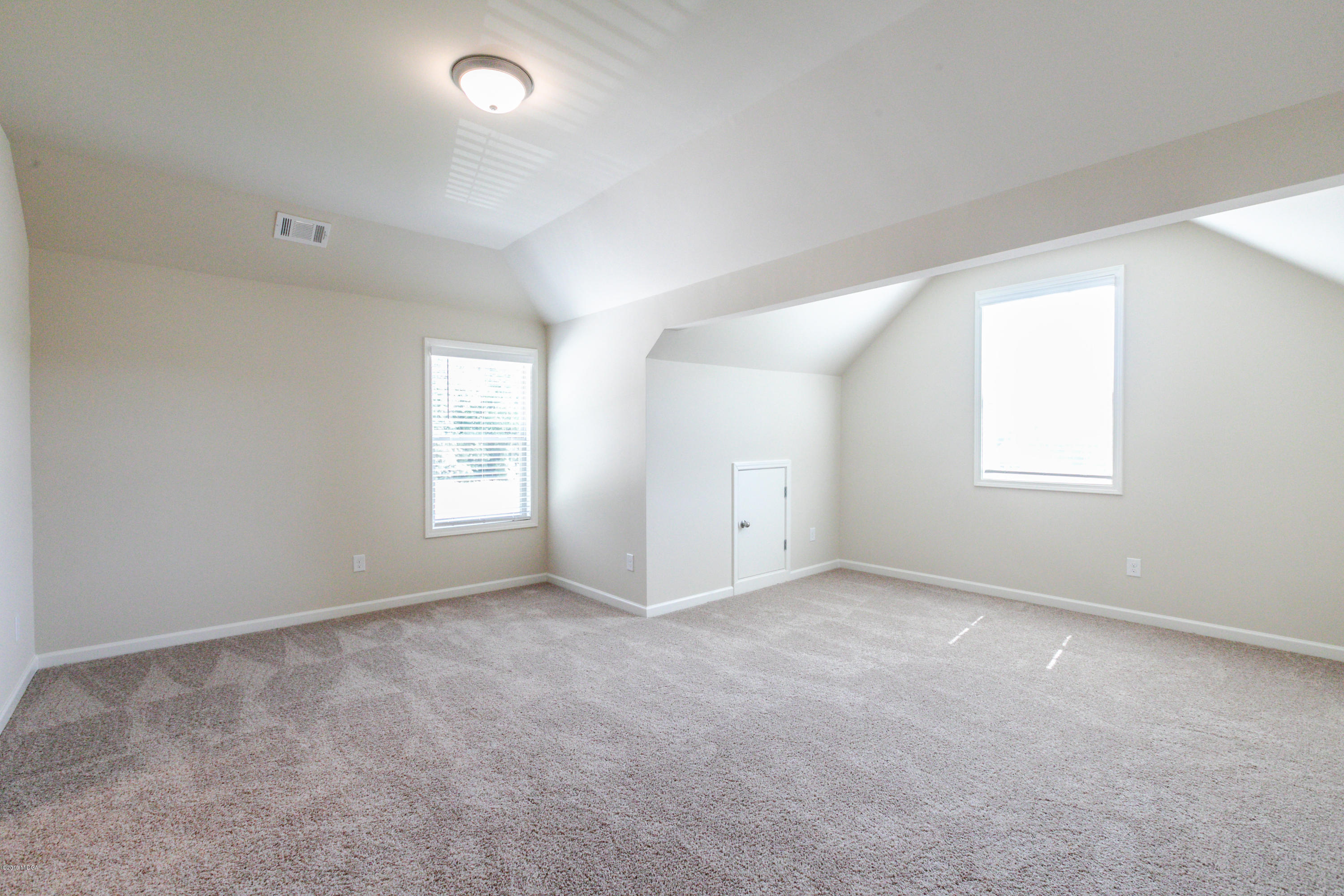 160 Homestead Circle Forsyth, GA 31029 - Photo 37 of 40 an empty room with windows