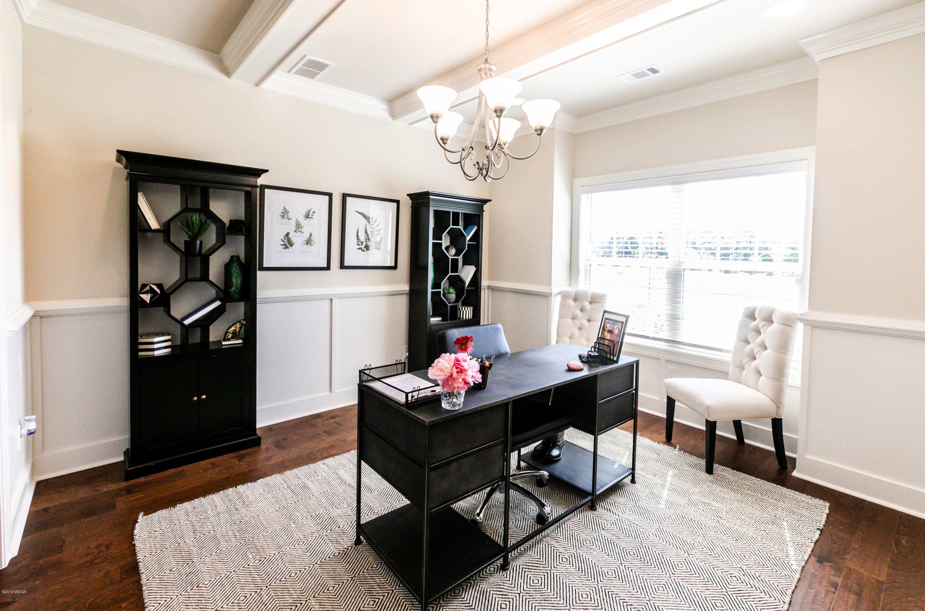 160 Homestead Circle Forsyth, GA 31029 - Photo 5 of 40 a living room with furniture and a large window