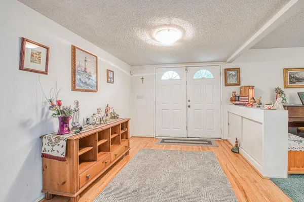 a room with furniture and white walls