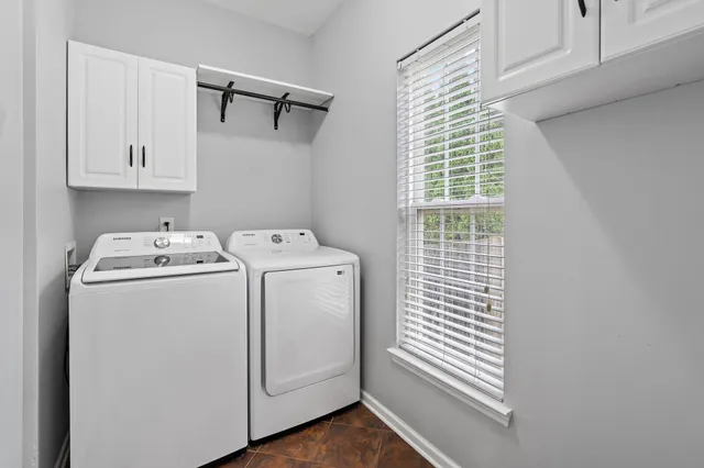 a utility room with dryer and washer