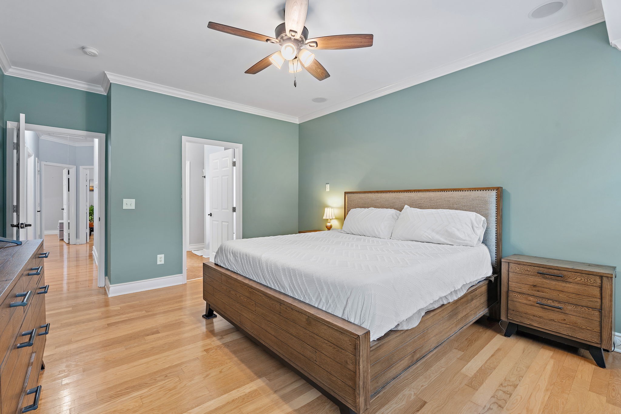 1025 Countess Lane Spring Hill, TN 37174 - Photo 13 of 38 a bedroom with a bed and a chandelier