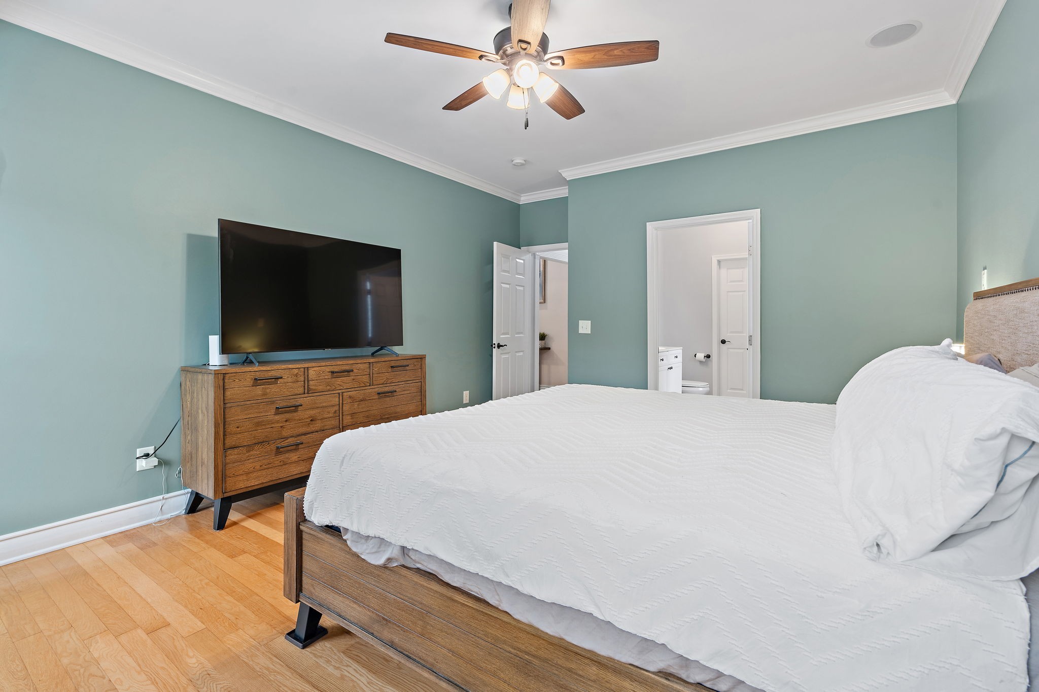 1025 Countess Lane Spring Hill, TN 37174 - Photo 15 of 38 a bedroom with a bed and a flat screen tv