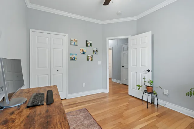 a bedroom with a bed and a couch