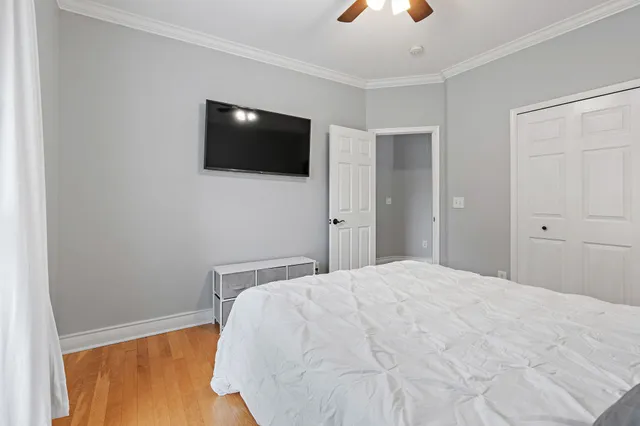 a large white bed in a white room