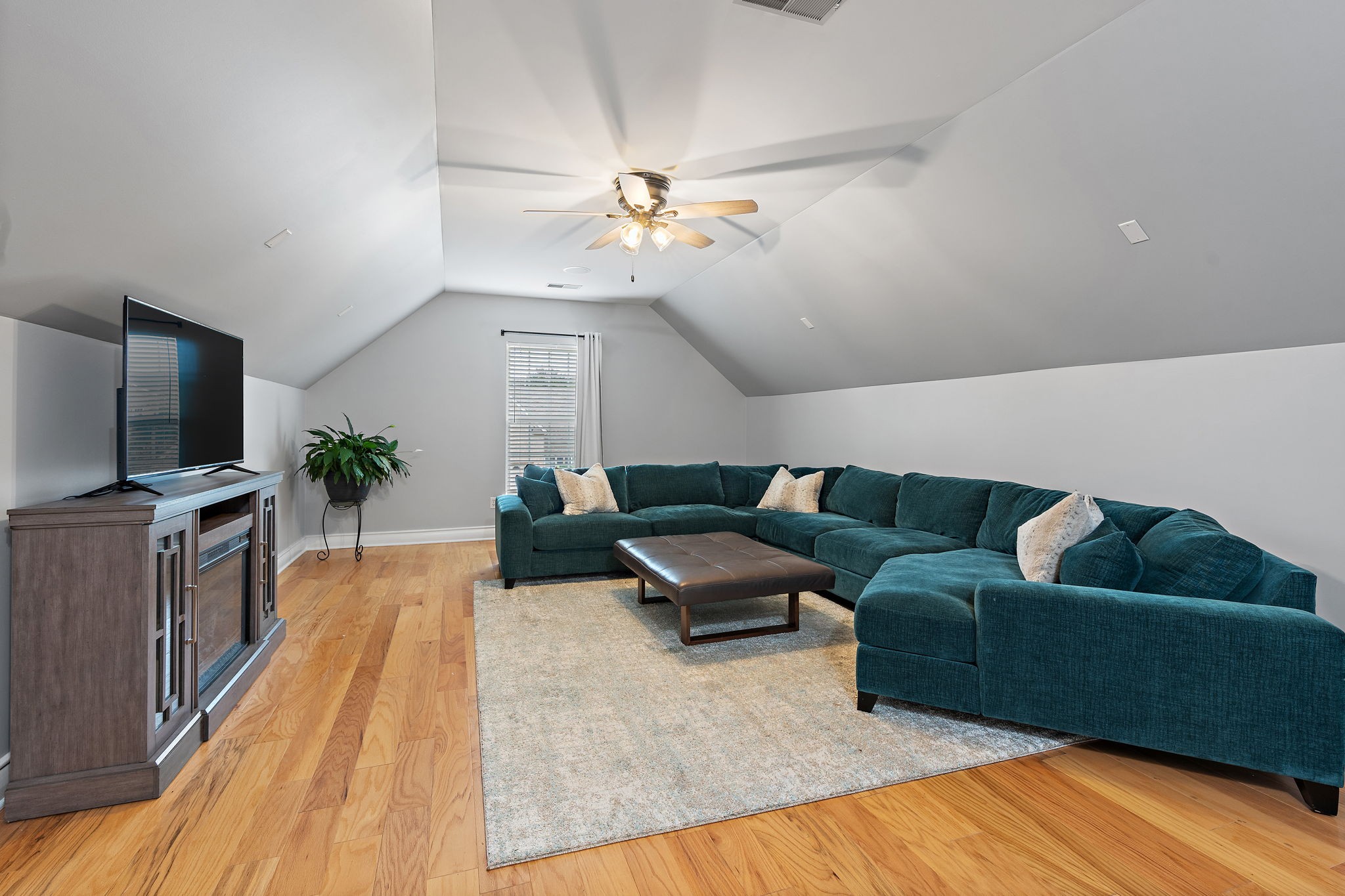1025 Countess Lane Spring Hill, TN 37174 - Photo 23 of 38 a living room with furniture and a flat screen tv