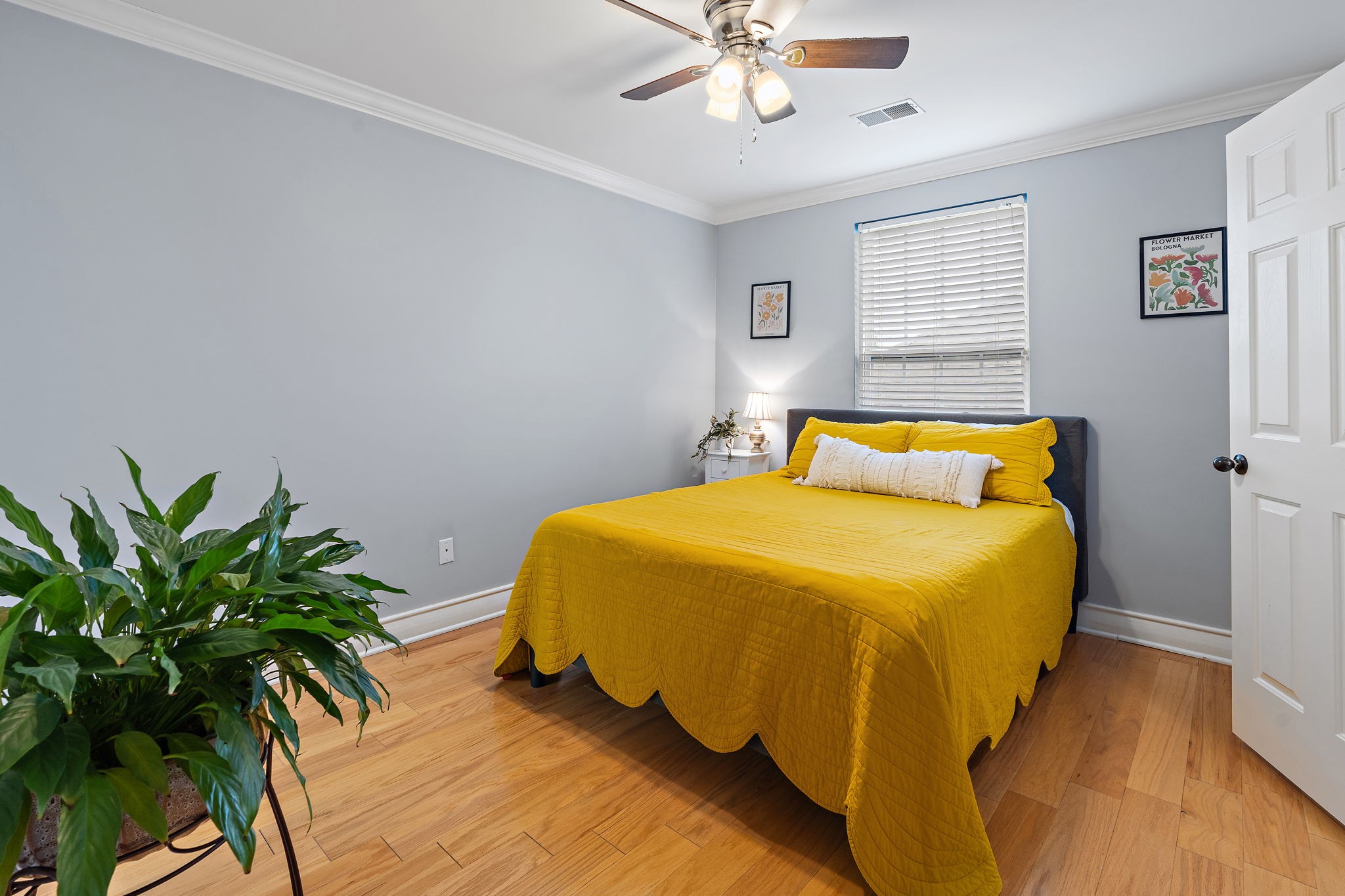 1025 Countess Lane Spring Hill, TN 37174 - Photo 25 of 38 a bedroom with a bed and a potted plant