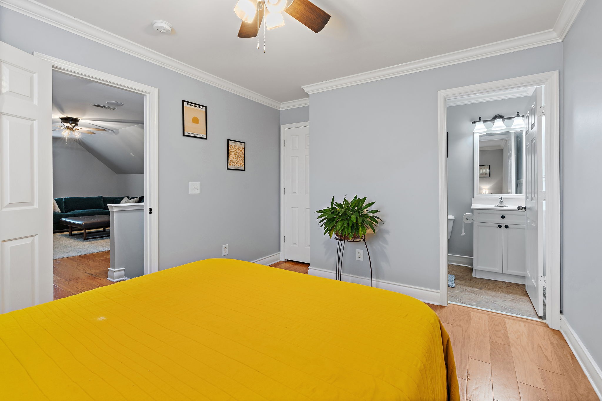 1025 Countess Lane Spring Hill, TN 37174 - Photo 26 of 38 a bedroom with a bed and a chandelier