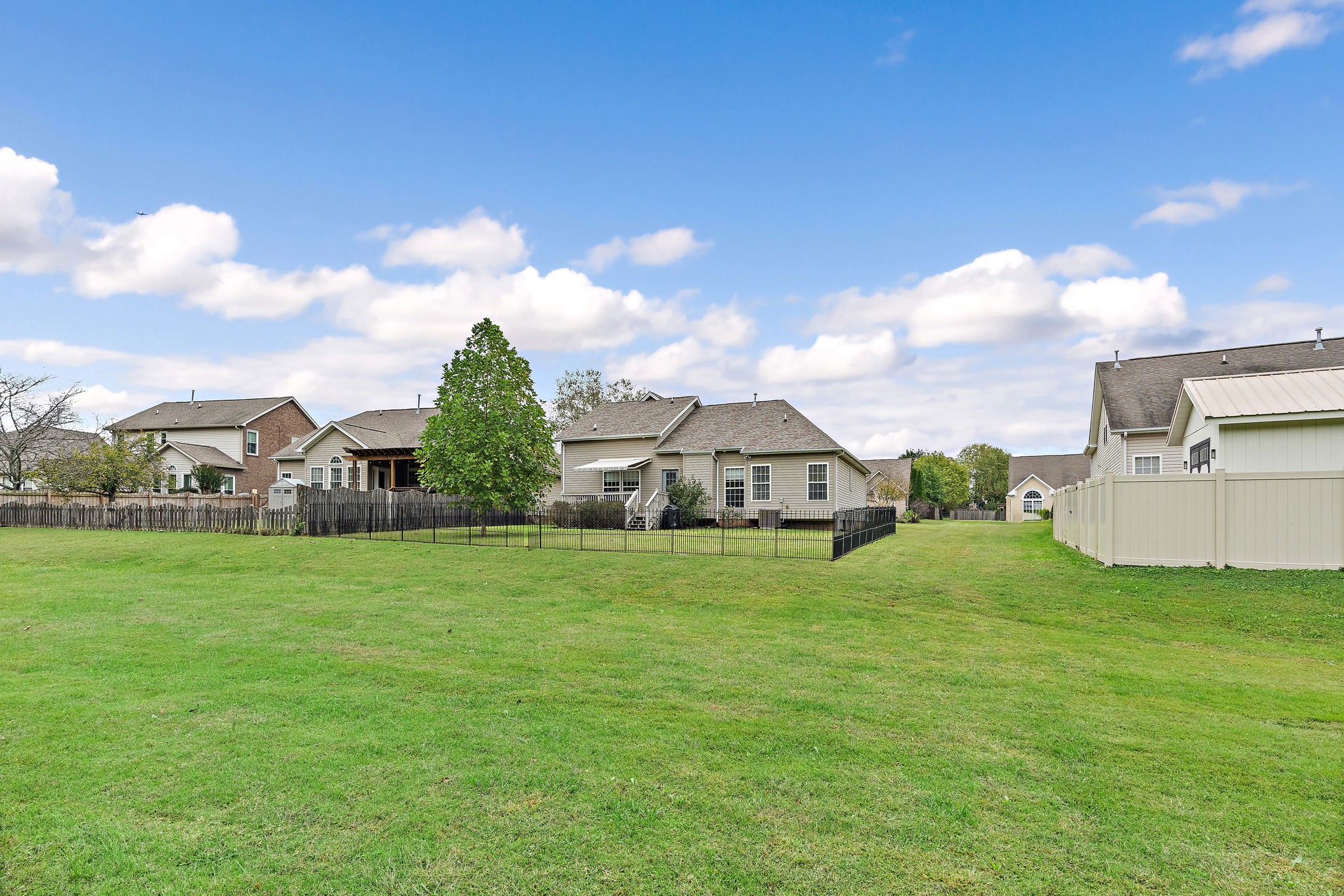 1025 Countess Lane Spring Hill, TN 37174 - Photo 33 of 38 a view of a big yard next to a house