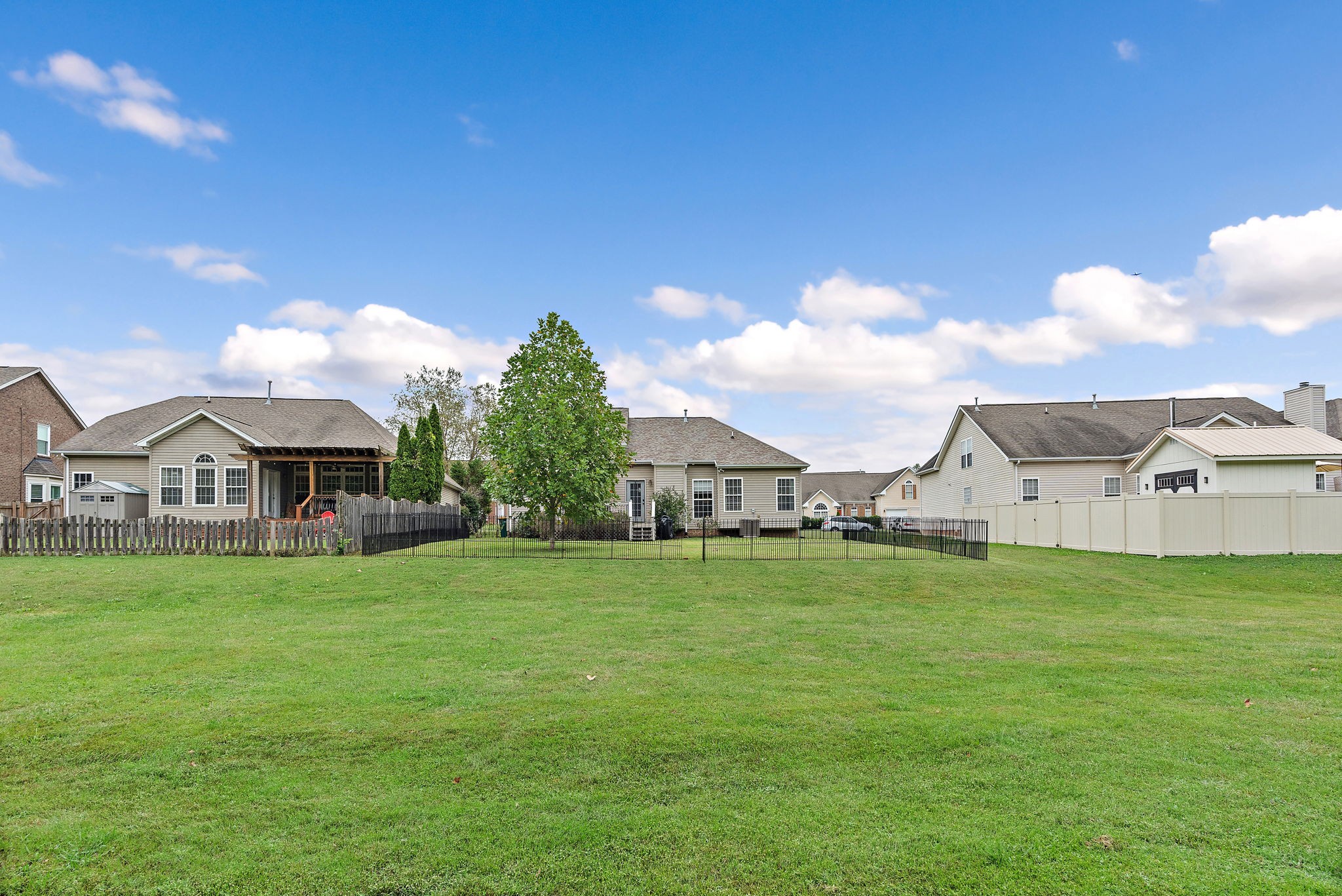 1025 Countess Lane Spring Hill, TN 37174 - Photo 34 of 38 a front view of a house with a yard and garage