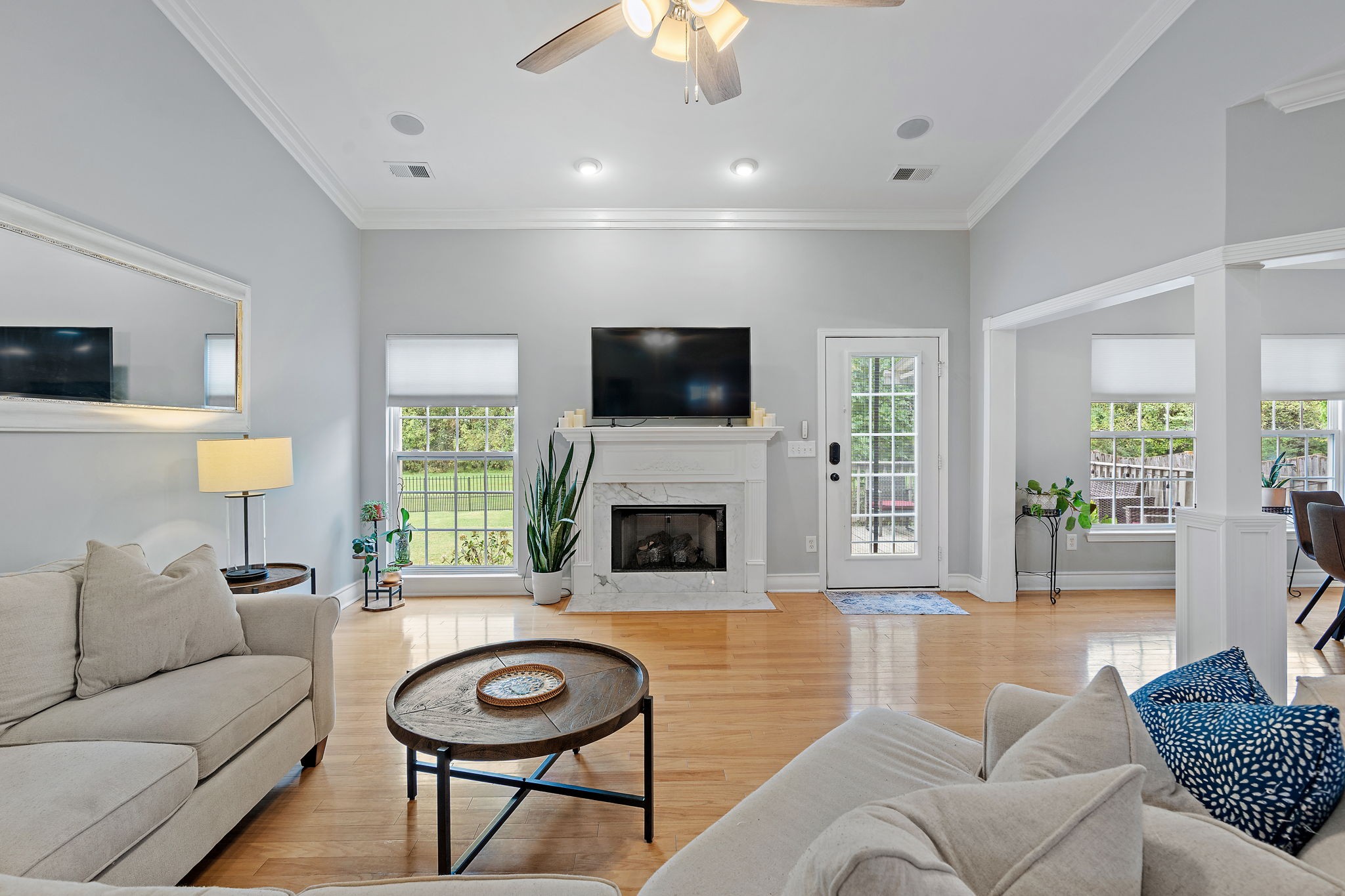 1025 Countess Lane Spring Hill, TN 37174 - Photo 5 of 38 a living room with furniture a fireplace and a flat screen tv
