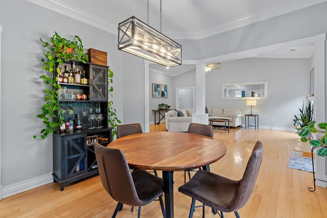 a view of a dining room with furniture and wooden floor