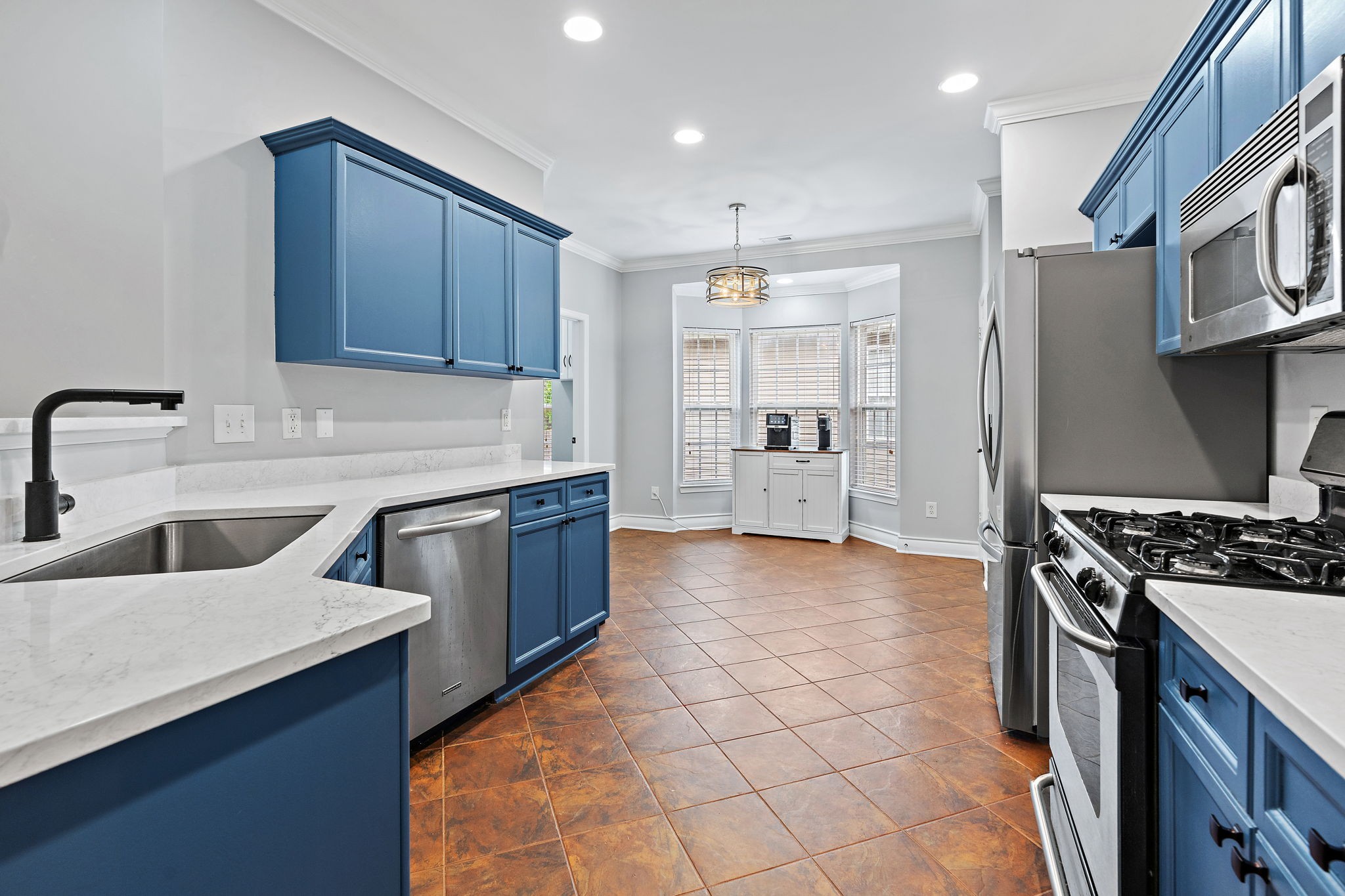 1025 Countess Lane Spring Hill, TN 37174 - Photo 9 of 38 a kitchen with stainless steel appliances granite countertop a stove a sink and a refrigerator