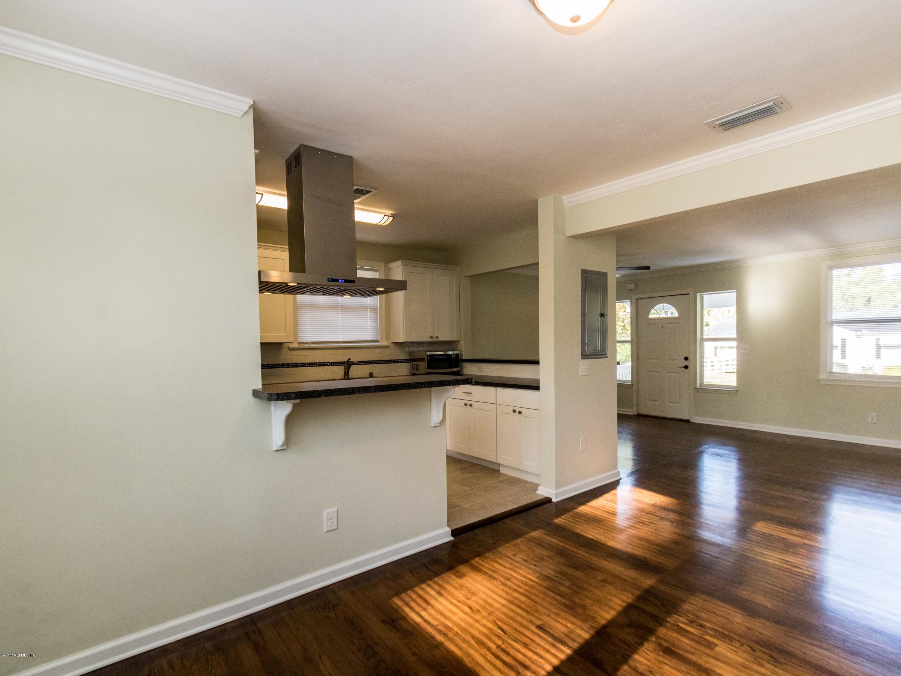 1764 Planters Road Jacksonville, FL 32207 - Photo 11 of 24 a view of a kitchen with wooden floor