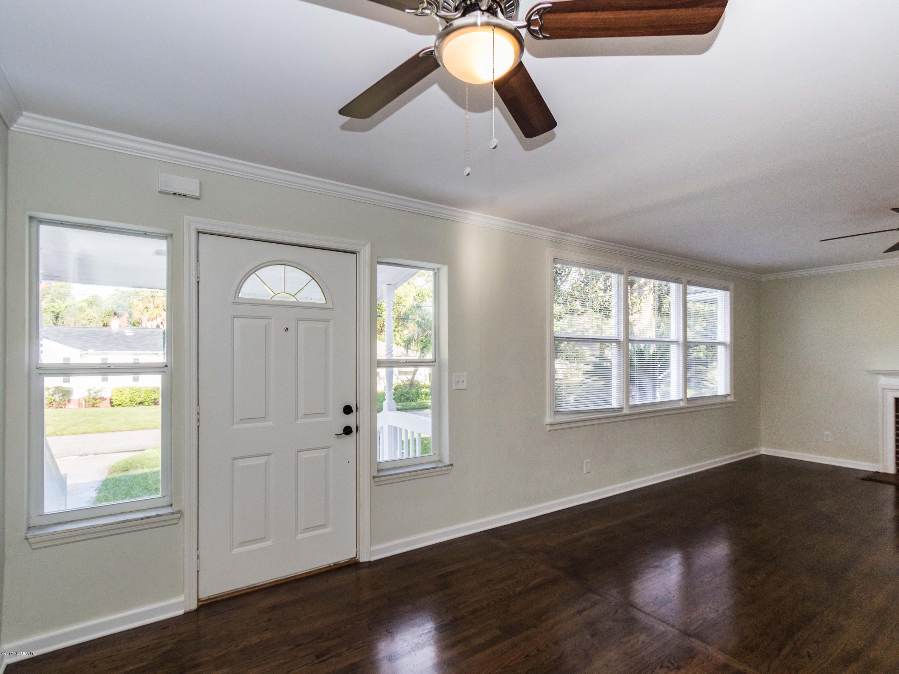 1764 Planters Road Jacksonville, FL 32207 - Photo 5 of 24 a view of empty room with wooden floor and fan