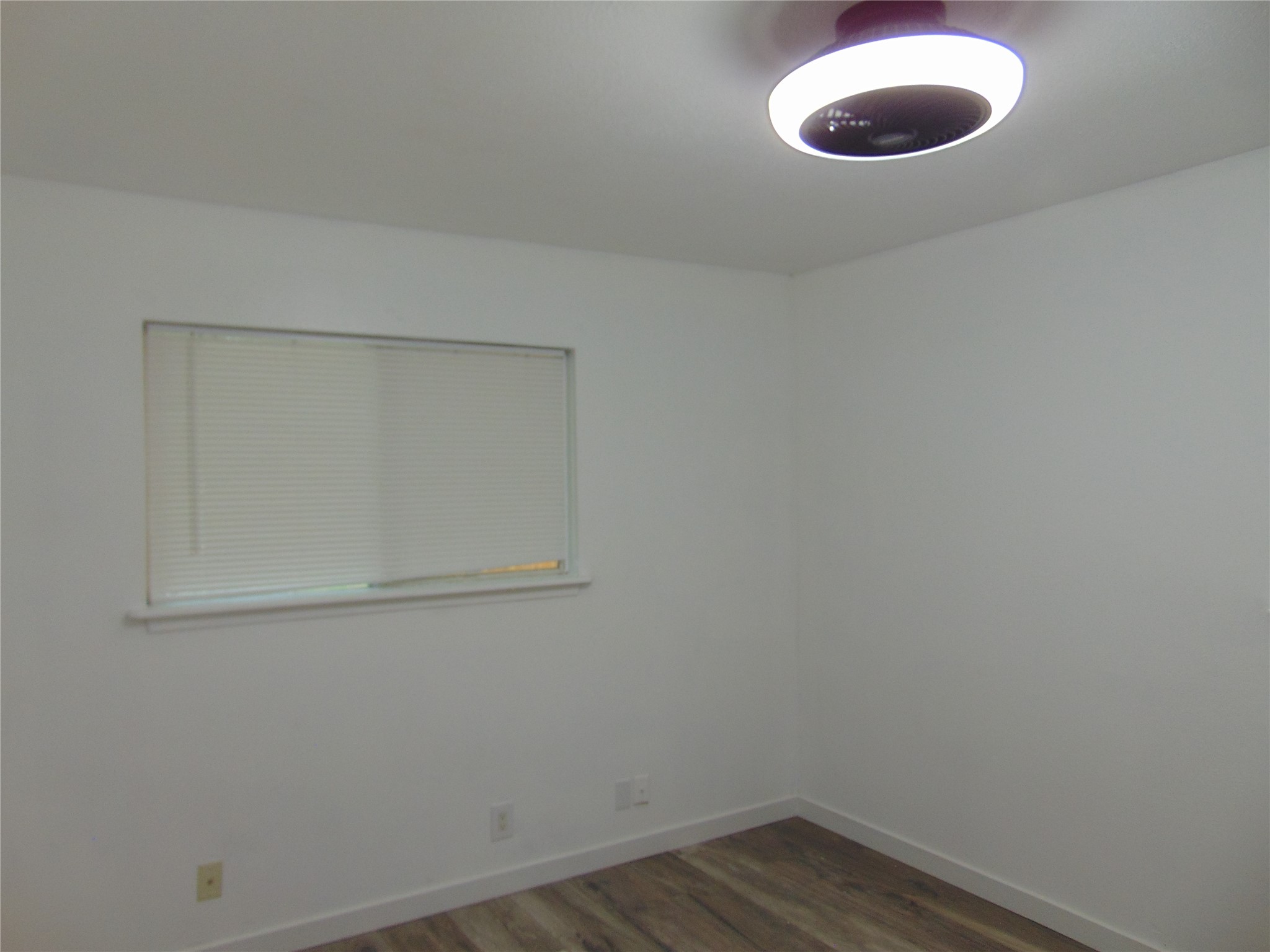 407 Live Oak Street Kyle, TX 78640 - Photo 7 of 9 a view of a room with wooden floor