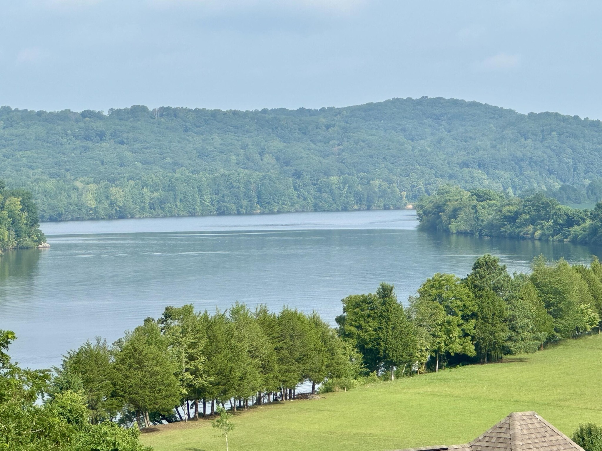 70 Espalier Drive Decatur, TN 37322 - Photo 1 of 7 a view of a lake with a mountain in the background